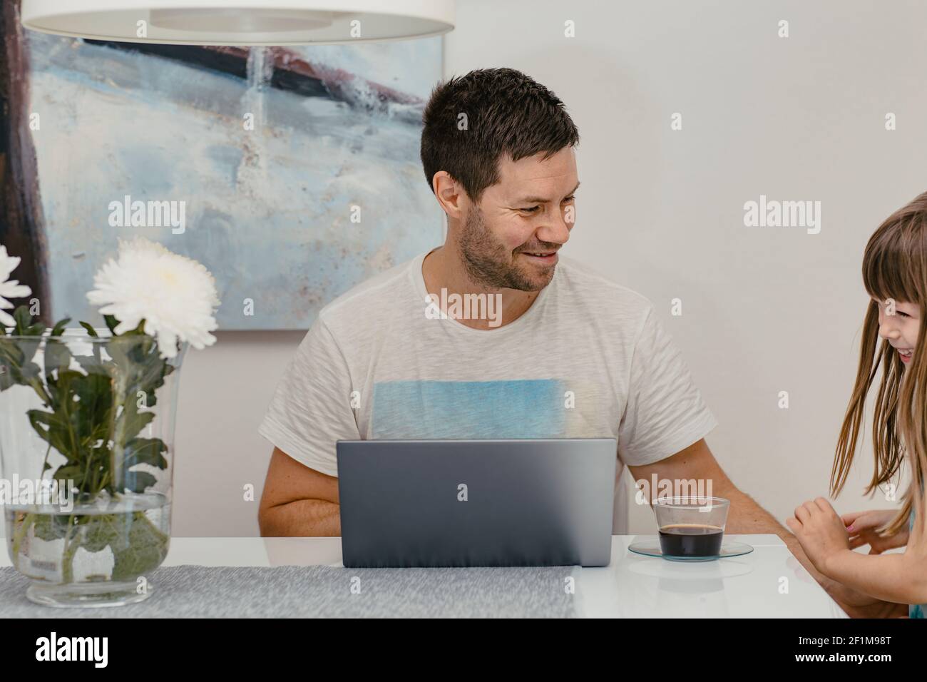 Father and daughter using laptop Stock Photo