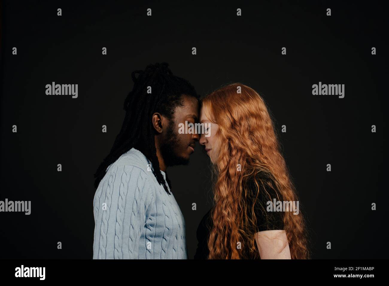 Couple together, studio shot Stock Photo