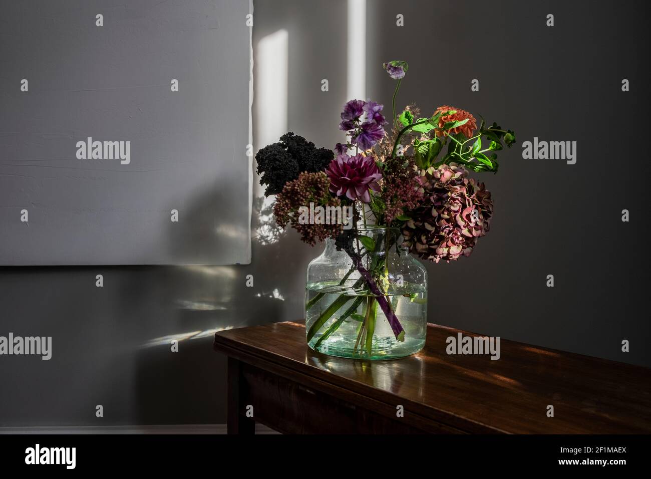 Colorful bouquet in glass vase Stock Photo