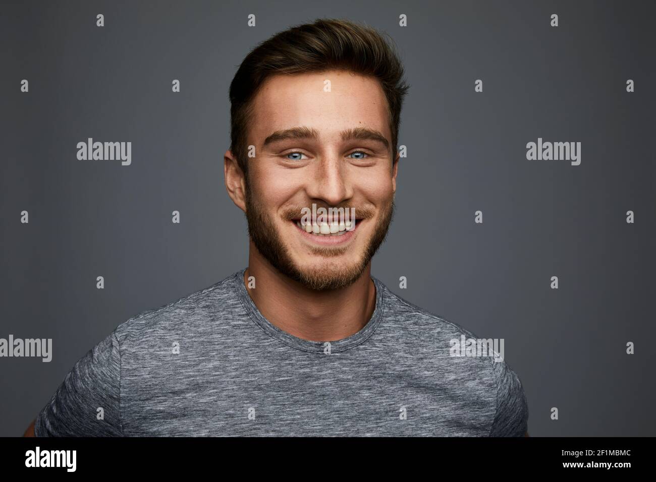 Studio shot of smiling young man Stock Photo