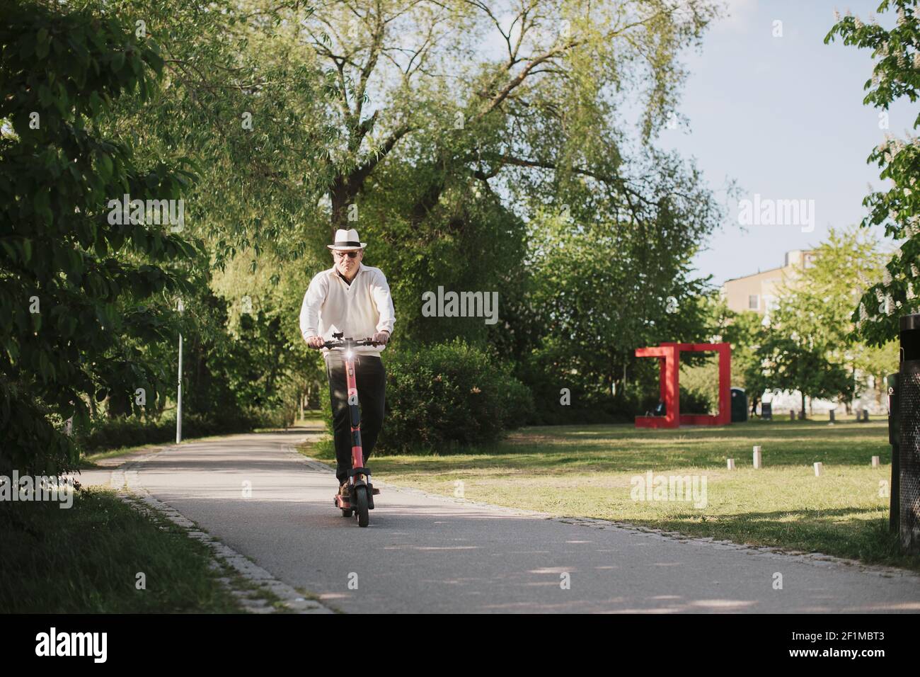 Man riding electric scooter hi-res stock photography and images - Alamy
