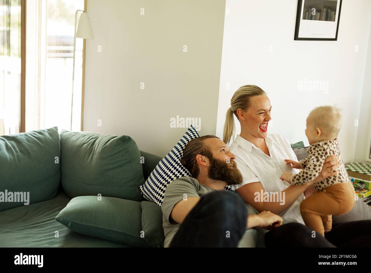 Mother baby girl on sofa hi-res stock photography and images - Alamy