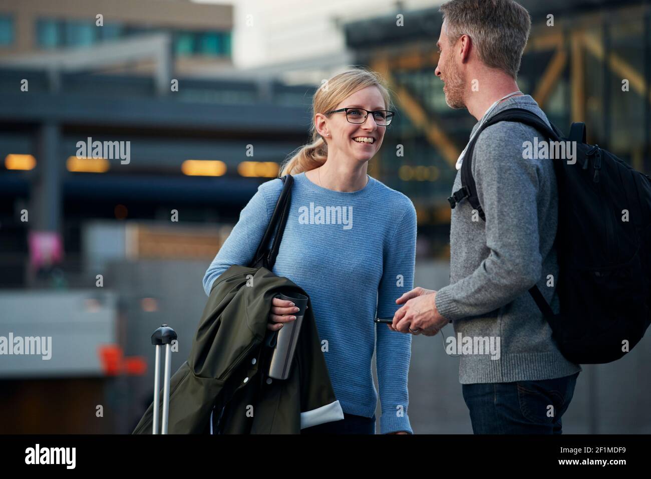 Man and woman talking Stock Photo - Alamy