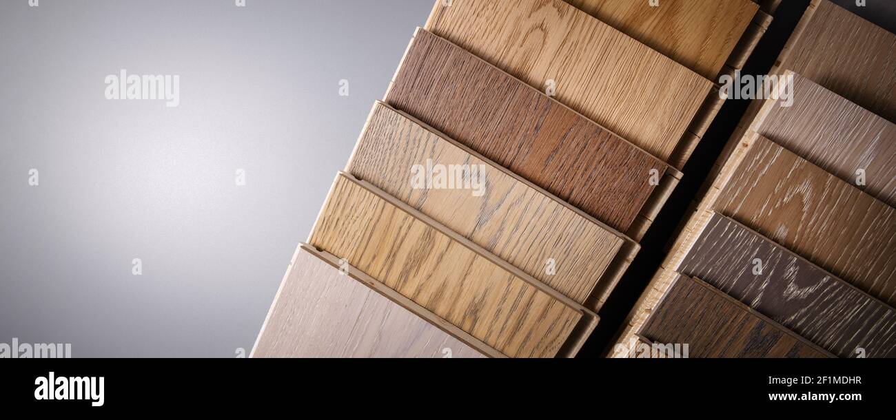 oak parquet flooring samples on gray background with copy space Stock Photo