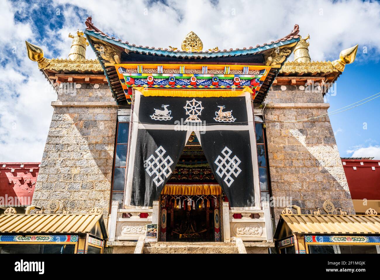 Main building front view of Baiji or one hundred chicken Tibetan Buddhist temple in Shangri-La Yunnan China Stock Photo