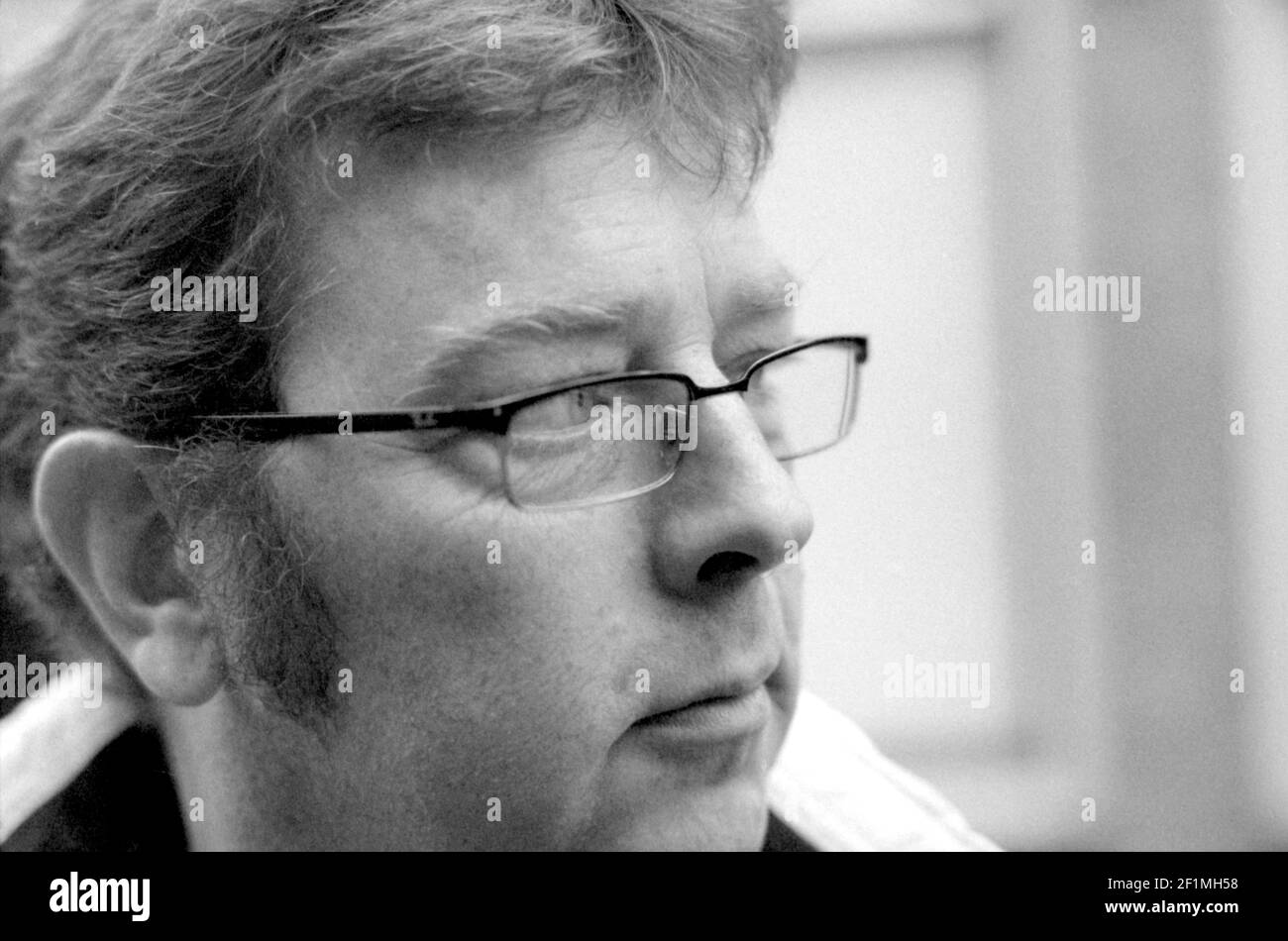 Tilburg, Netherlands. Portrait in Black & White of a mature adult male wearing glasses. Stock Photo
