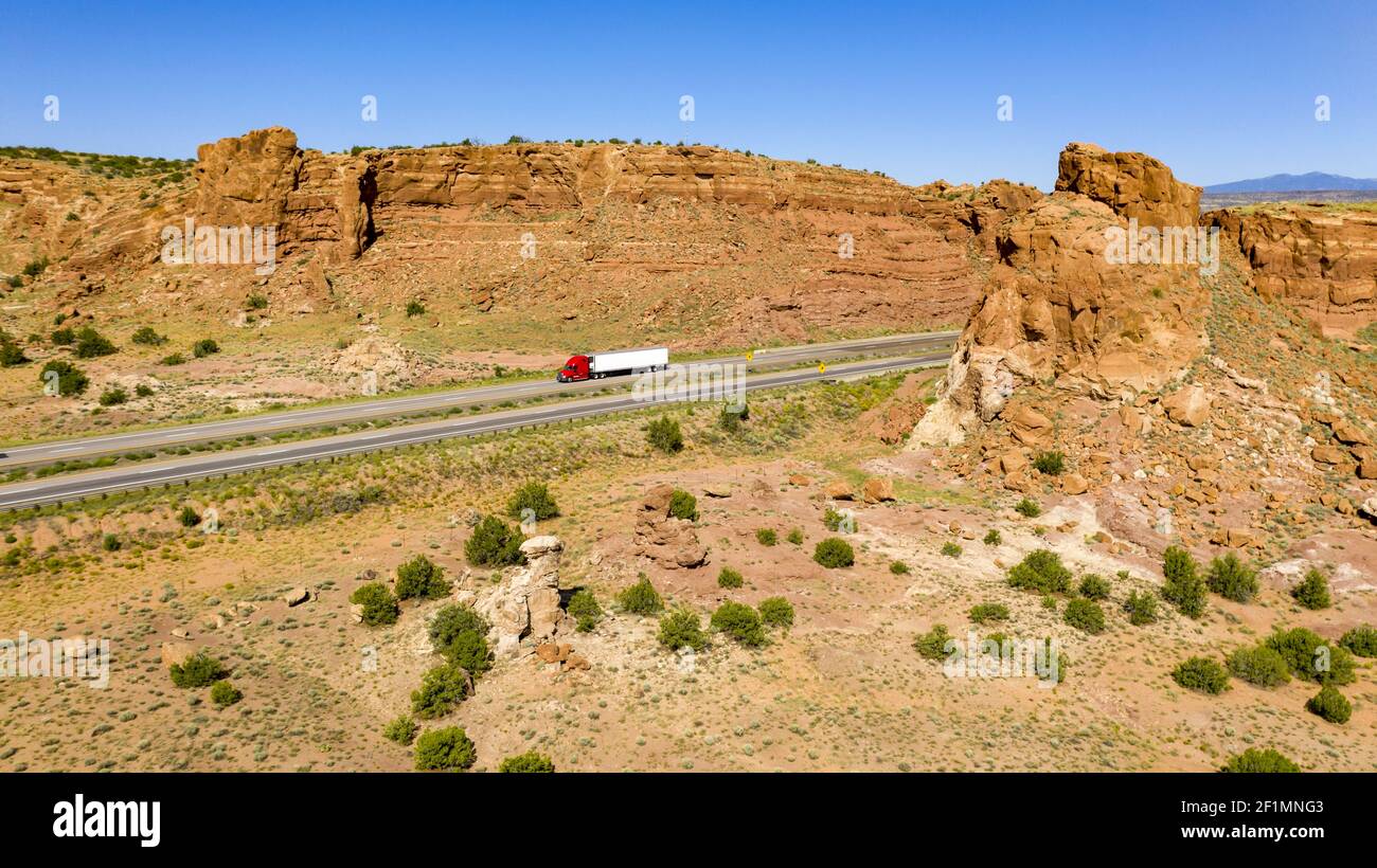 Vehicle Traffic moves along a Divided Highway in southwestern Desert Country Stock Photo