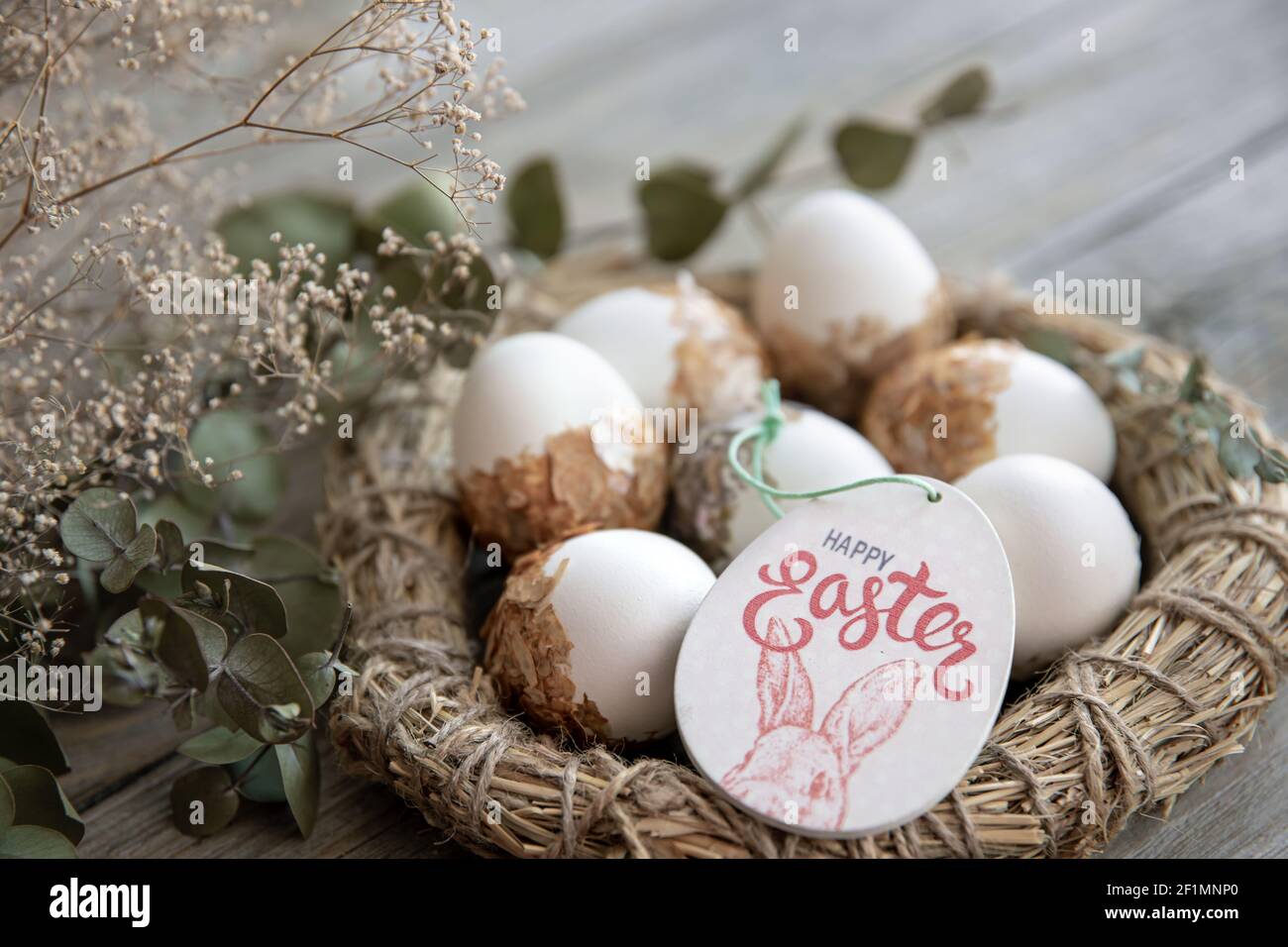 Easter still life with decorated Easter eggs and decorative nest on a ...