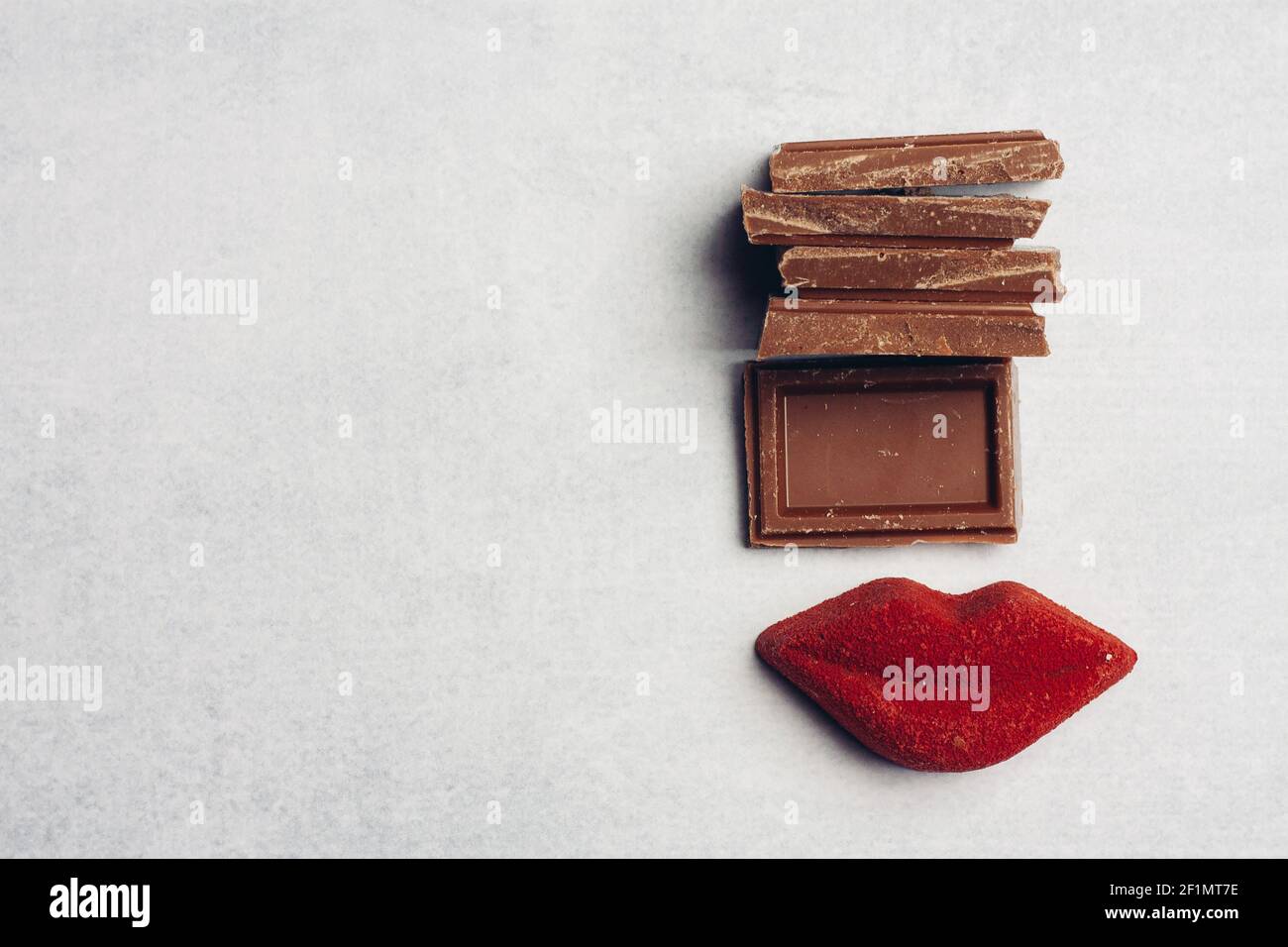 chocolate bar red lips marmalade sweets dessert top view Stock Photo