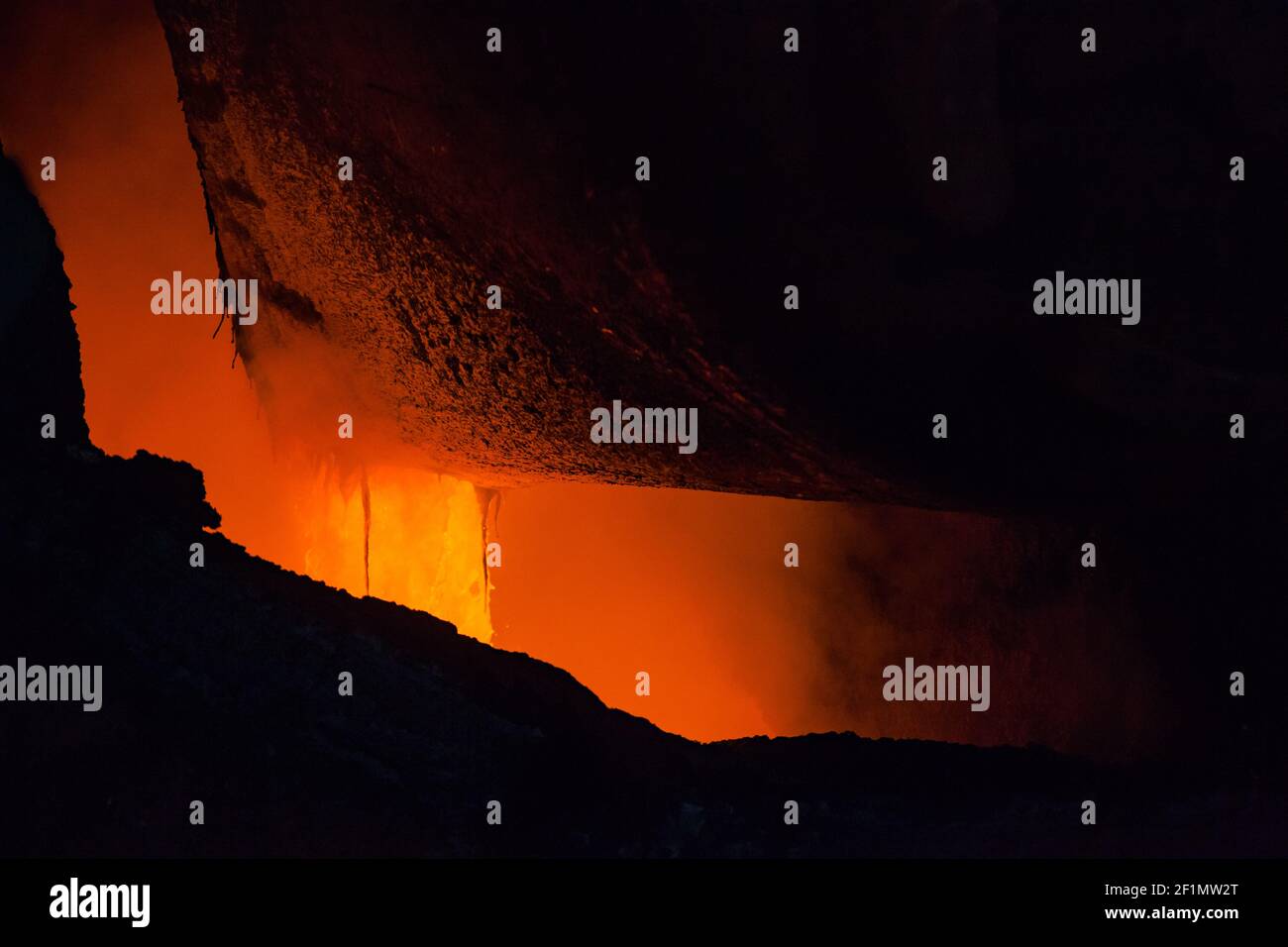 Melting copper in Pierce-Smith converter. Close-up of metallurgy bucket with liquid metal. Metallurgy workshop of Kazzinc company,Ust'-Kamenogorsk. Stock Photo