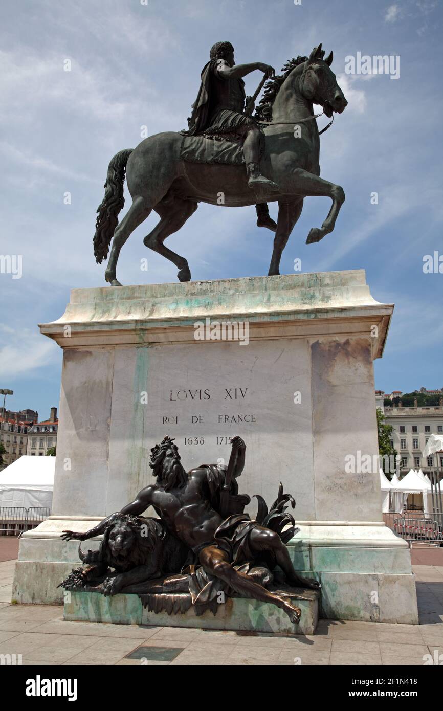 Equestrian statue of Louis XIV on Place Bellecour between the Rivers Saône (1818) and Rhône at Lyon with the Basilique Nôtre-Dame-de-Fourvière beyond Stock Photo