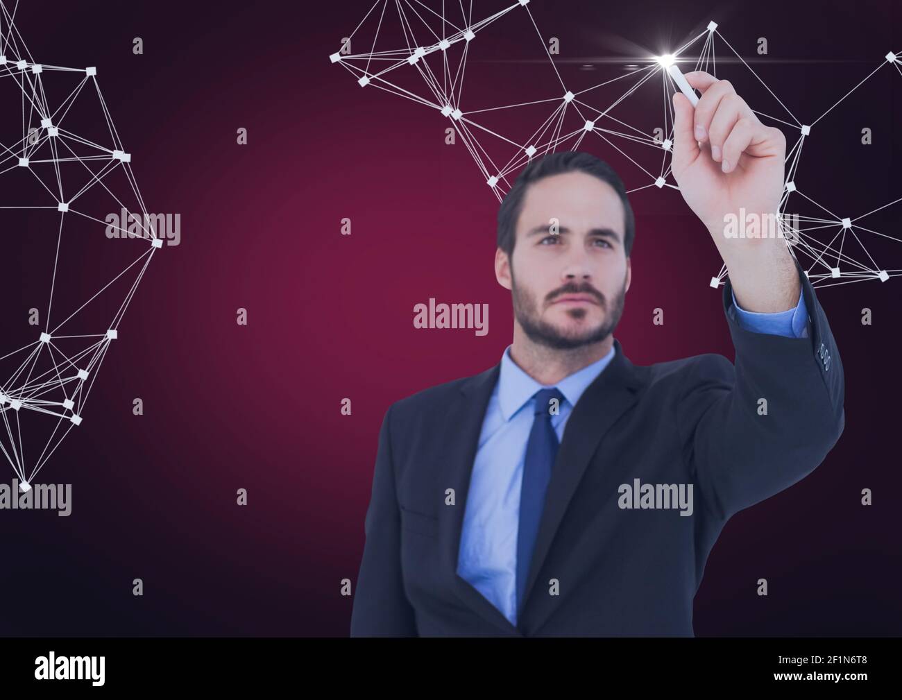 Network of connections against businessman writing on invisible screen against red background Stock Photo