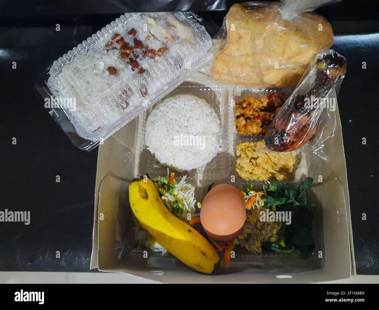 Indonesian ramadan rice lunch box called Aneka Nasi Kotak. An iftar