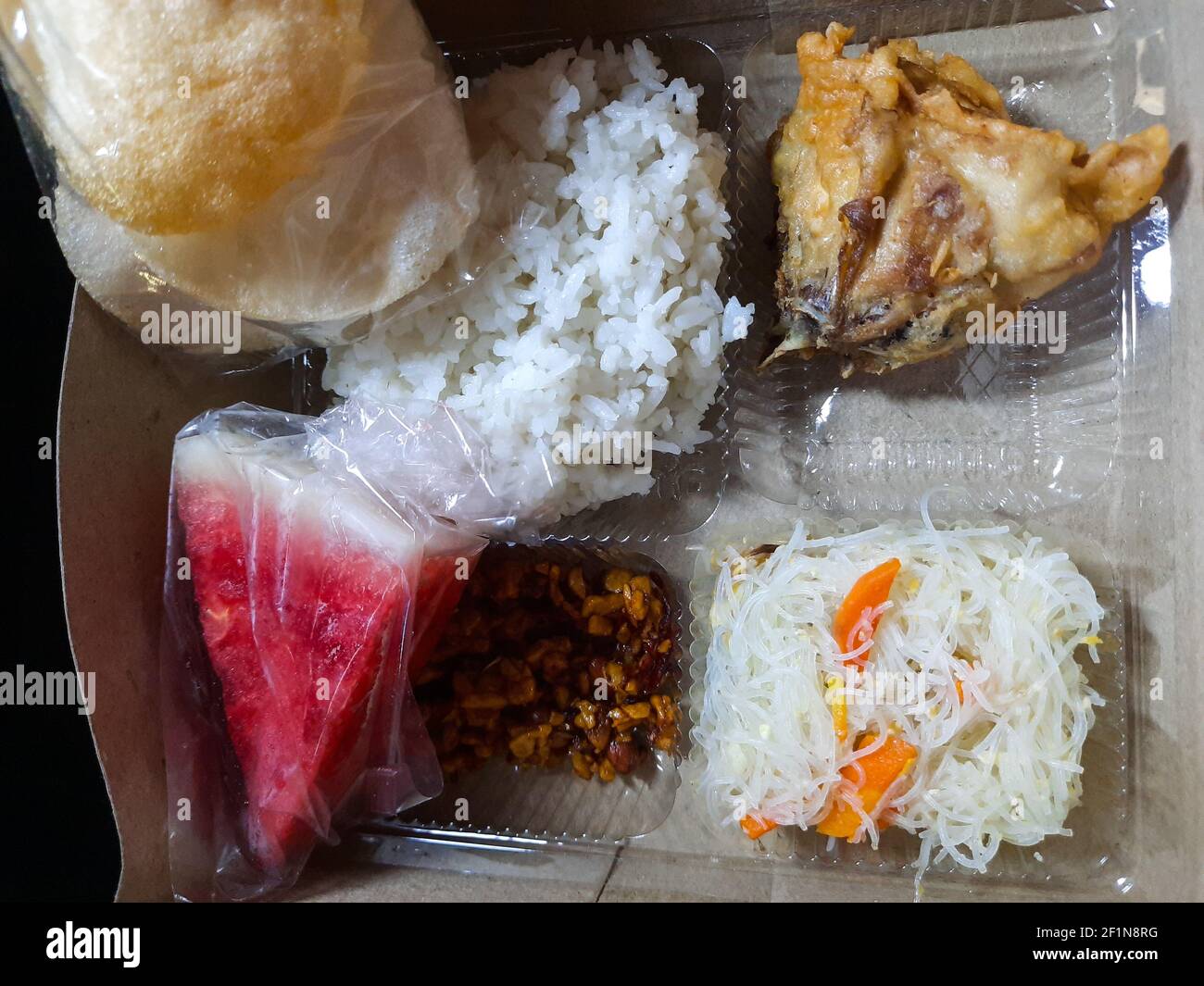 Indonesian ramadan rice lunch box called Aneka Nasi Kotak. An iftar