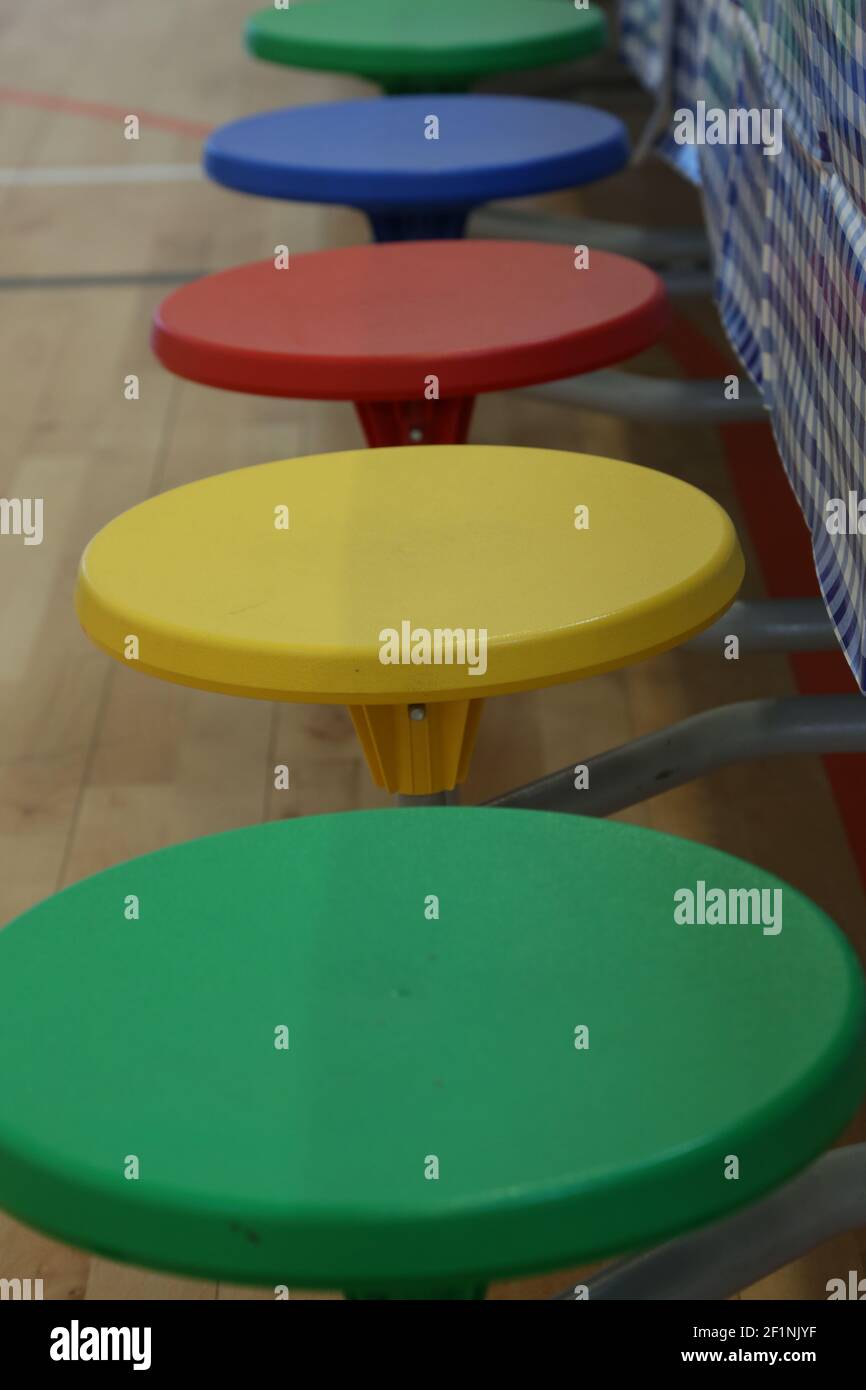 Colourful seats in school Stock Photo - Alamy