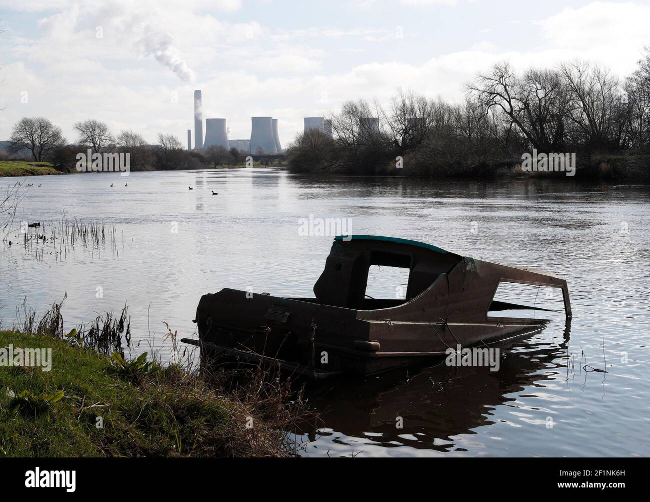 Sawley, Nottinghamshire, UK. 9th March 2021. A sunk boats sits in the River Trent near Ratcliffe-on-Soar Power Station as Rushcliffe Borough Council is to discuss an expression of interest for UniperÕs coal-powered Power Station site to accommodate a nuclear fusion reactor when it is decommissioned in 2025. Credit Darren Staples/Alamy Live News. Stock Photo
