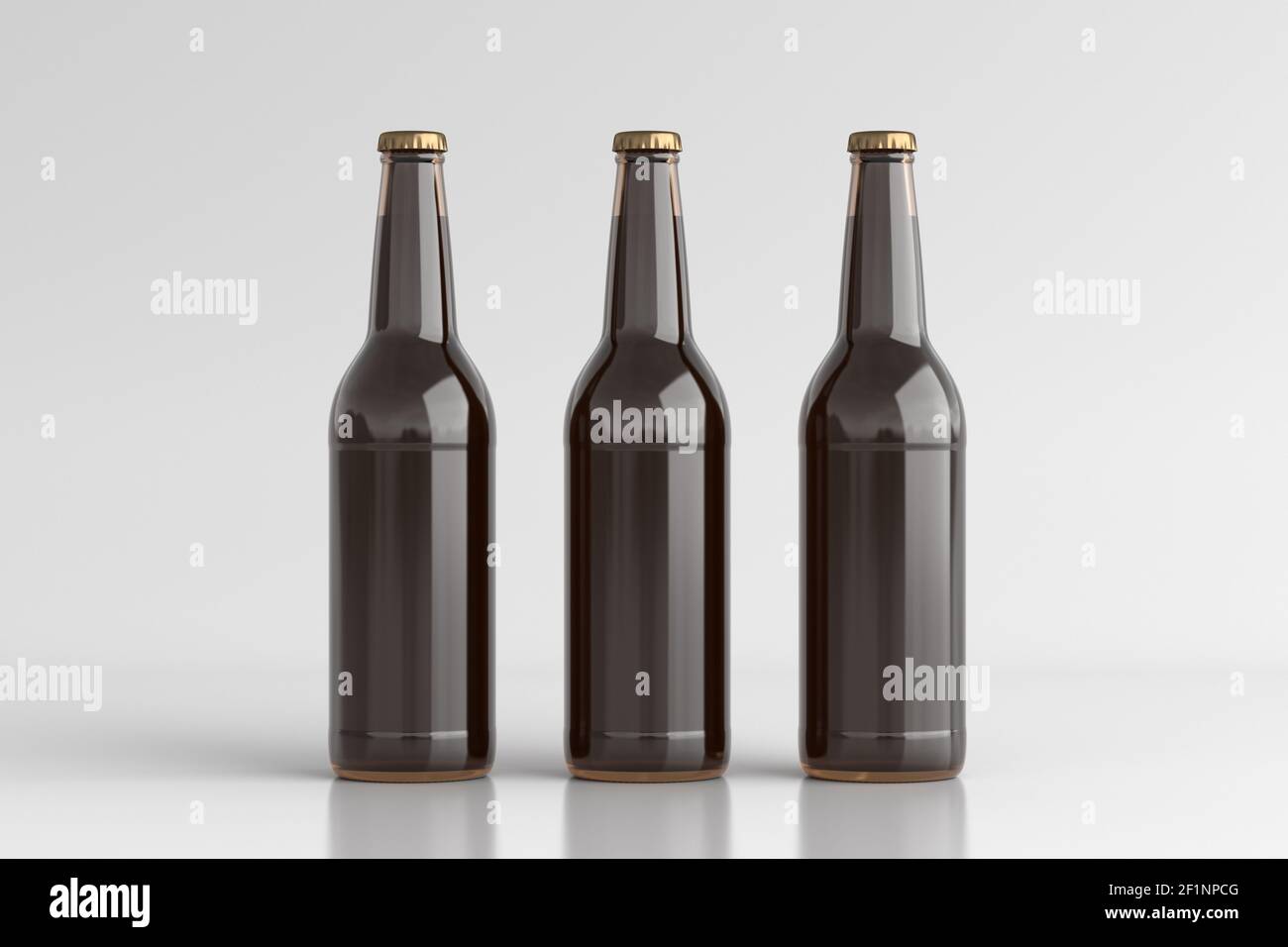 Three beer bottles 500ml mock up on white background. Front view Stock Photo