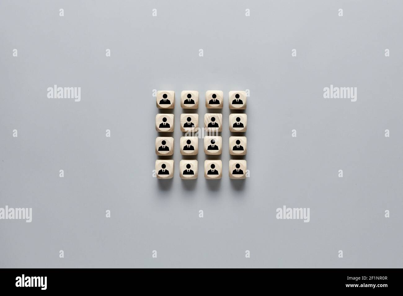 Wooden cubes with employee icons. Concept of recruitment, hiring or team building. Stock Photo