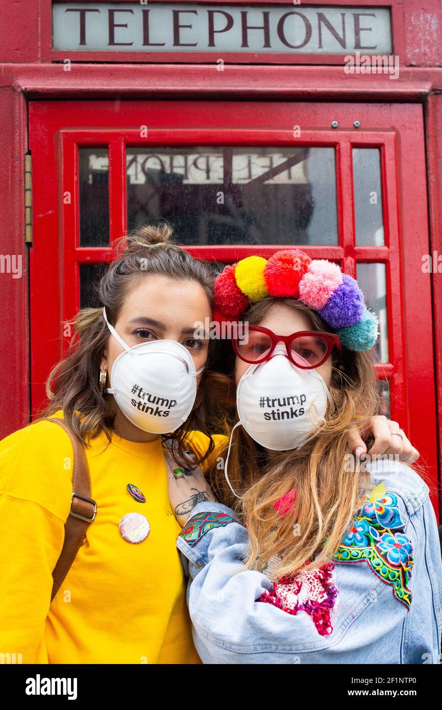L-r Lia Mayka from Philadelphia and Sarah-Jane Cavendish from London pictured near Trafalgar Square, London, where protests are taking place on the second day of the state visit to the UK by US President Donald Trump.   Lia is here to 'see what the rest of the world thinks about our national embarrassment'. Sarah-Jane is here in support of women's rights, LGBTQ rights and the climate. Photo credit should read: Katie Collins/EMPICS/Alamy Stock Photo