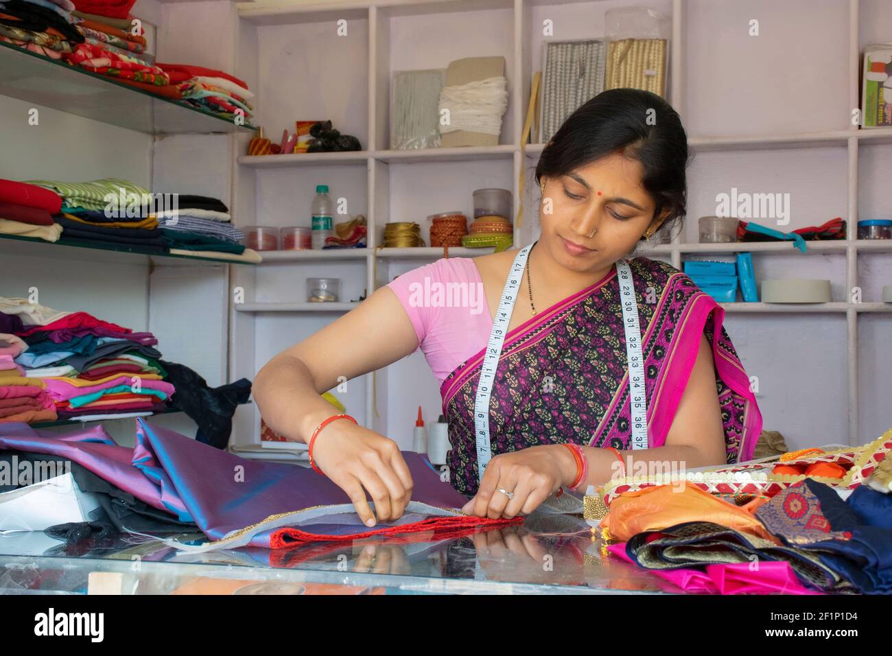 indian woman tailor or boutique owner at her Stock Photo Alamy