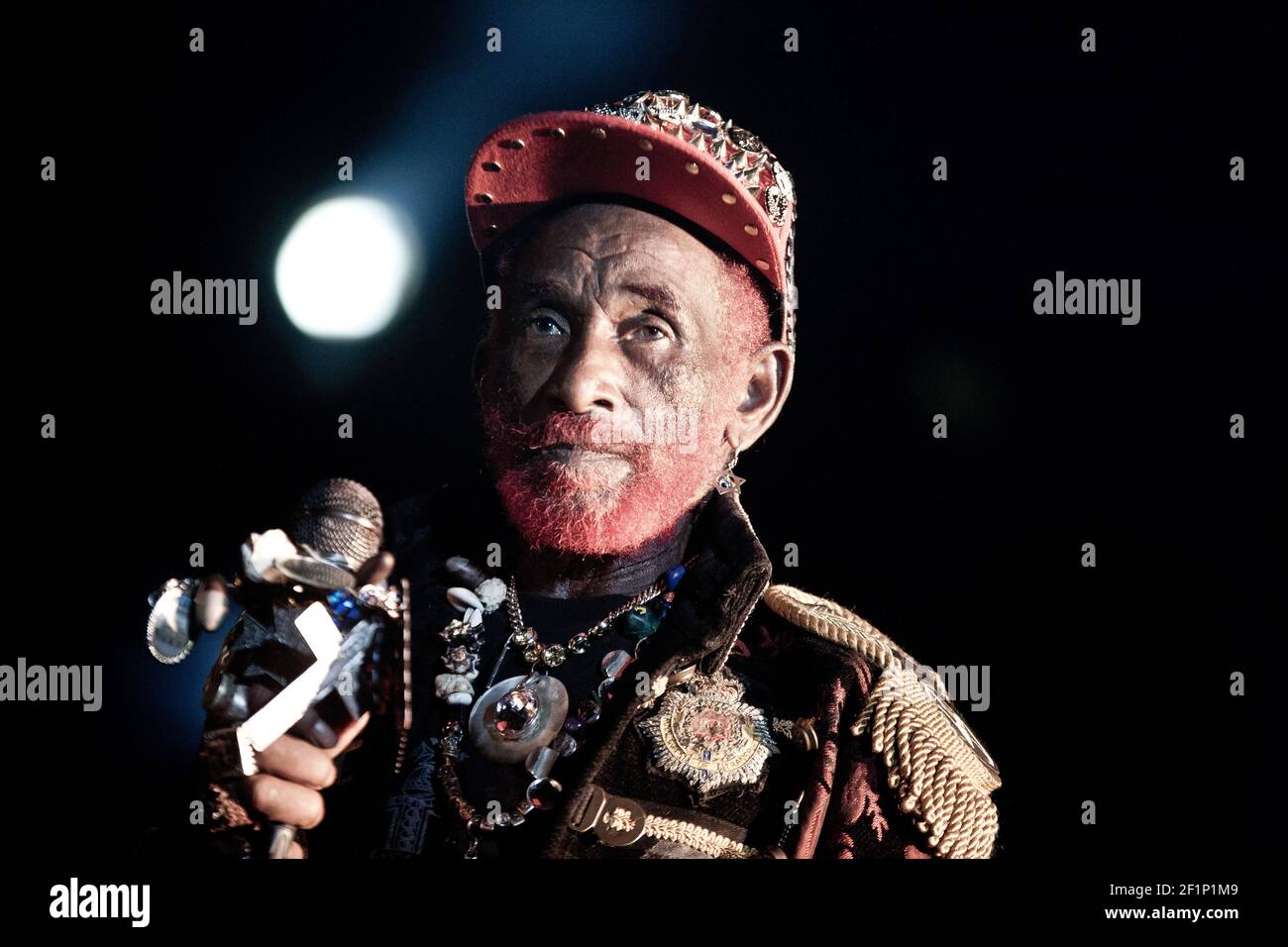 Michael Bunel / Le Pictorium -  Lee 'Scratch' Perry real name Rainford Hugh Perry -  27/07/2013  -  France  -  Lee 'Scratch' Perry (real name Rainford Hugh Perry, nicknamed among others The Neat little man, The Upsetter, Pipecock Jaxxton...) is a Jamaican producer and musician born in 1936. His works, his techniques, the sound he was able to obtain from his studio (with a simple 4-track at the beginning) as well as his various collaborations with all the gotha of the island have made him a pillar of the Jamaican sound, from ska to reggae, a style that he has left his mark. July 27th, 2013 Stock Photo