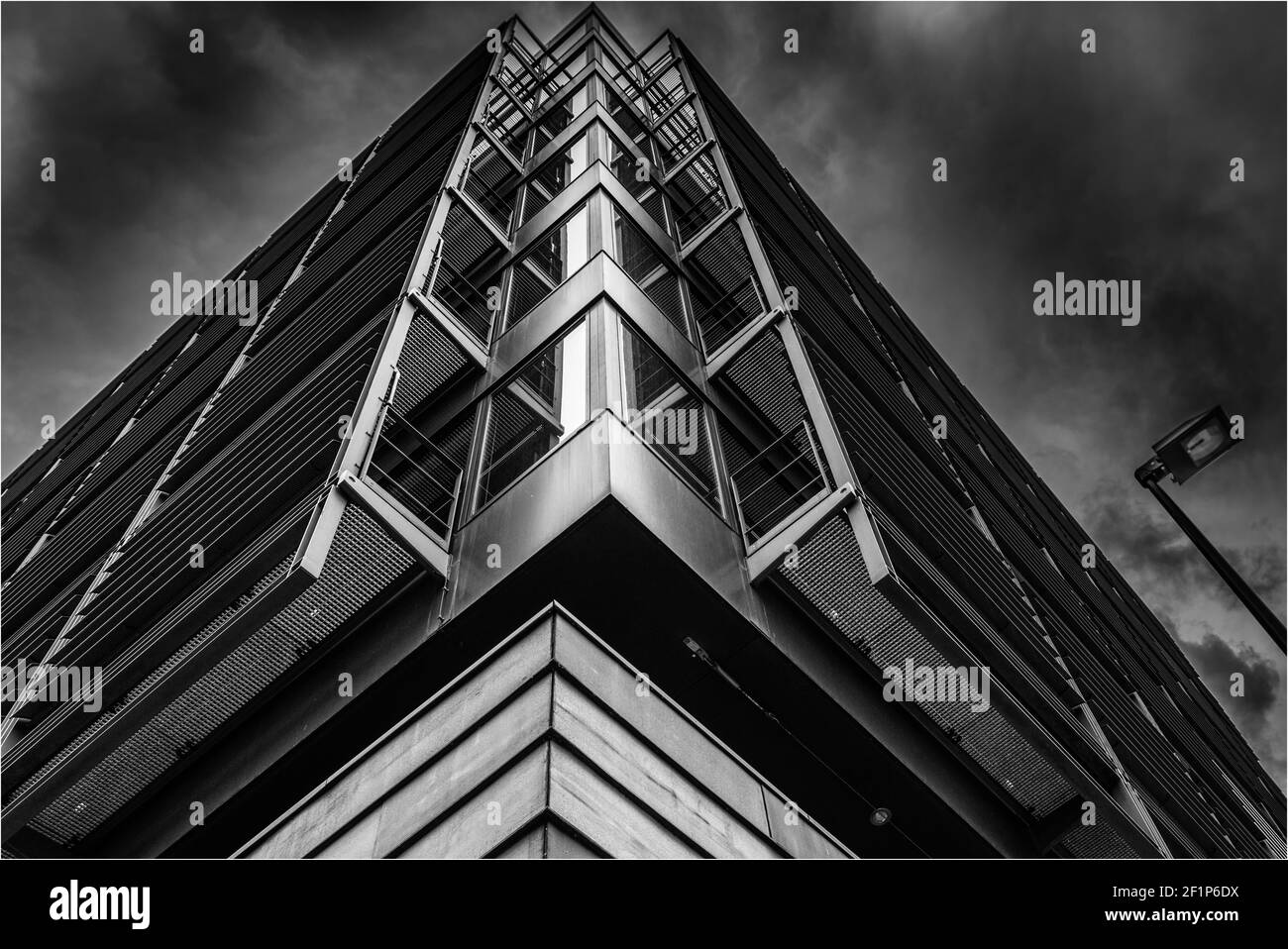 A low angle shot of an apartment building against the cloudy sky Stock Photo