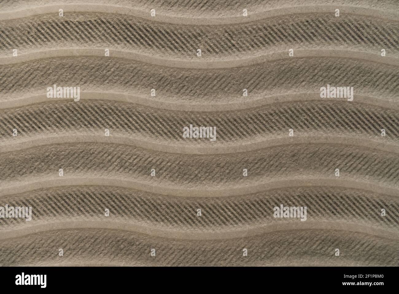 grey, cement textured surface, with horizontal wavy lines, top view Stock Photo