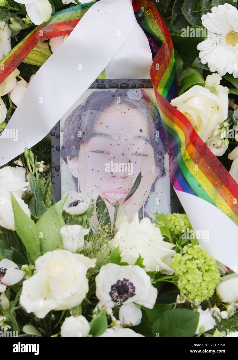 A picture of the activist Xingshun Zhou and flowers placed in memory by LGBT Asylum Support at the Homomonument on March 9, 2021 in Amsterdam, Netherlands. Xingshun Zhou (Marlon) an Chinese activist transwoman 23-year old forced to move from China to seek asylum in the Netherlands, because of the systematic homophobic and sexist repression against LGBTQIA  Community, died by suicide on February 26, 2021 at Echt village after her asylum application was denied by immigration authorities in the Netherlands. (Photo by Paulo Amorim/Sipa USA) Stock Photo