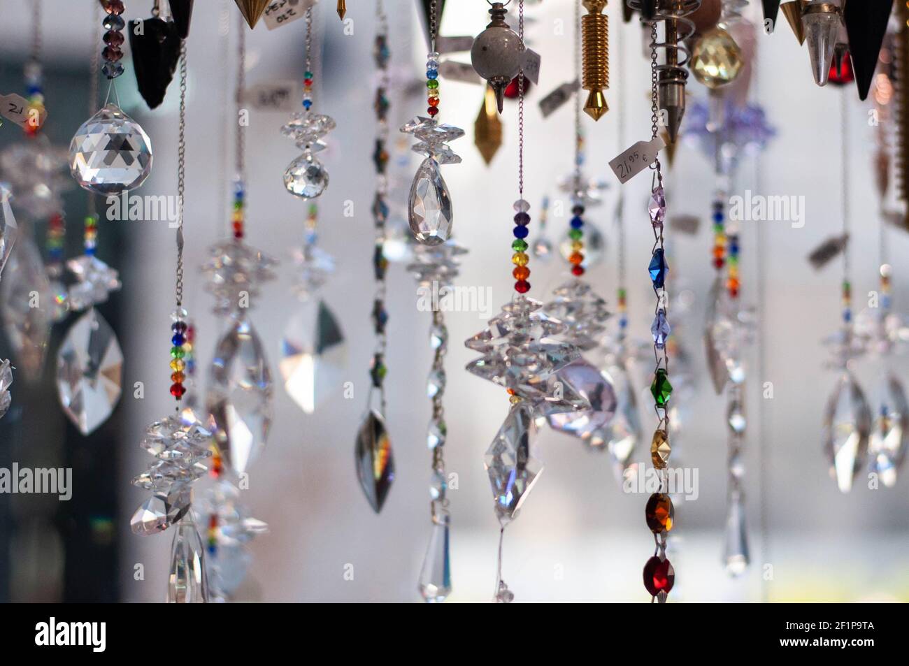 pendulums hanging future prediction tool in store Stock Photo