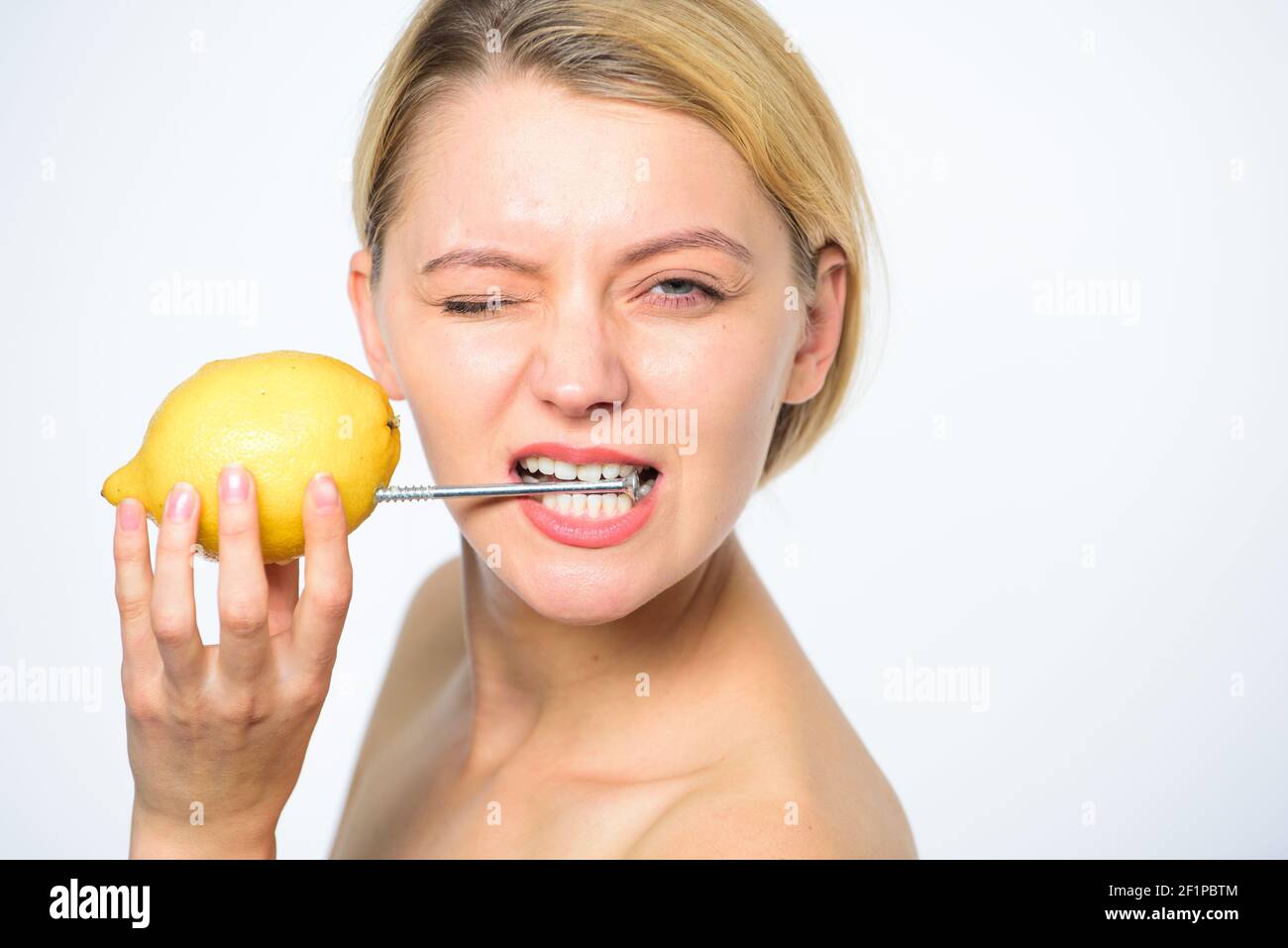 Recharge your body vitamins. Girl drink fresh juice whole lemon fruit