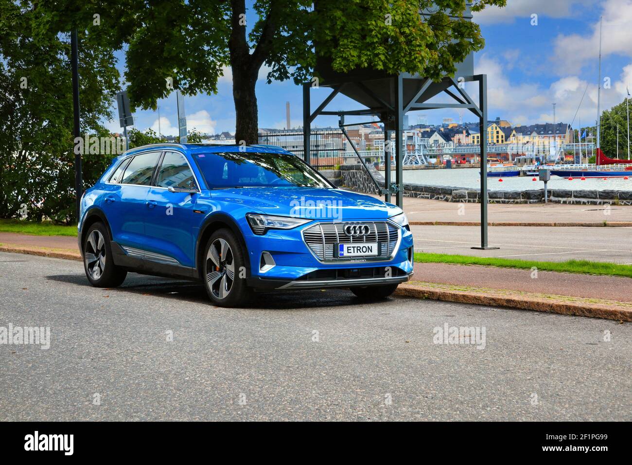 Blue Audi E-tron 55 Quattro, fully-electric mid-size luxury crossover SUV produced by Audi, parked by street. Helsinki, Finland. August 24, 2020. Stock Photo
