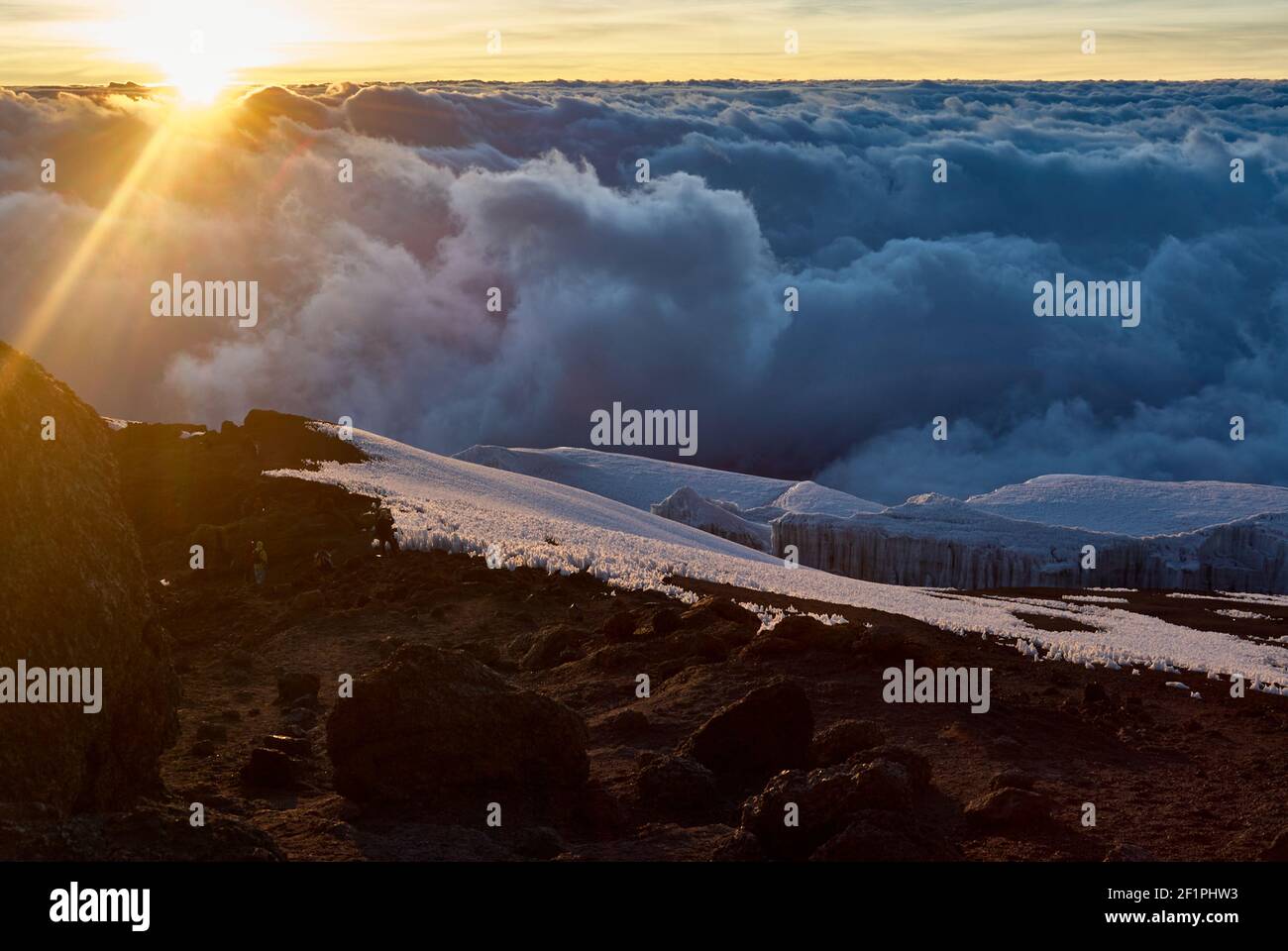sunrise at summit of Mount Kilimanjaro, UHURU PEAK,Tanzania, Africa  Sonnenaufgang am Kraterrand des Kilimanjaro, UHURU PEAK,Tansania, Afrika Stock Photo