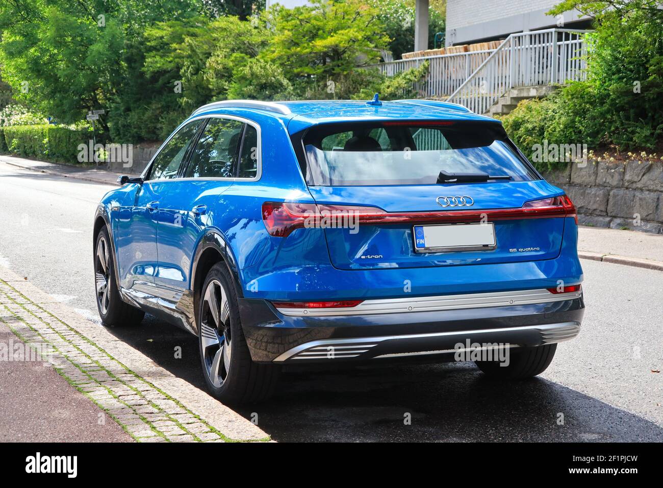 Blue Audi E-tron 55 Quattro, fully-electric mid-size luxury crossover SUV produced by Audi, parked by street. Helsinki, Finland. August 24, 2020. Stock Photo