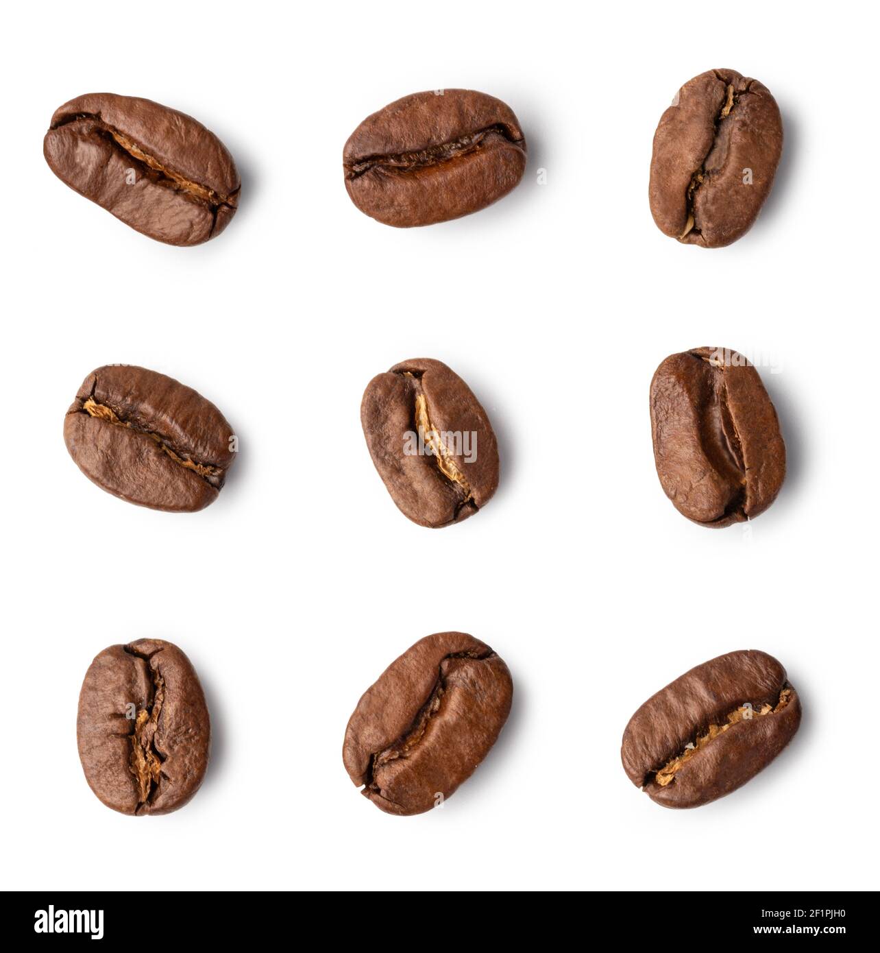 Roasted coffee beans on white background. Stock Photo
