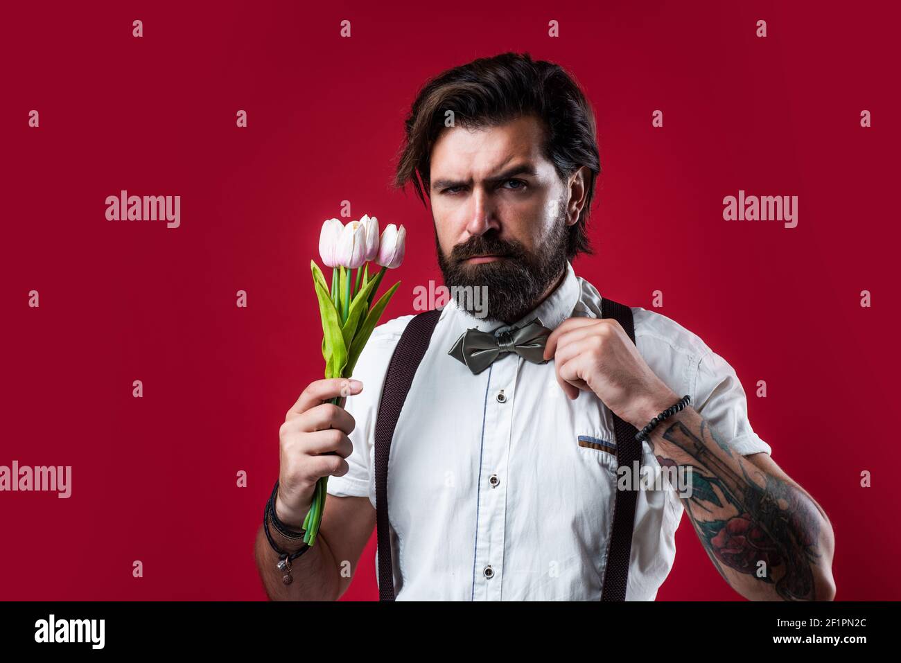 Allow life to thrive. romantic man in suspenders and bow tie