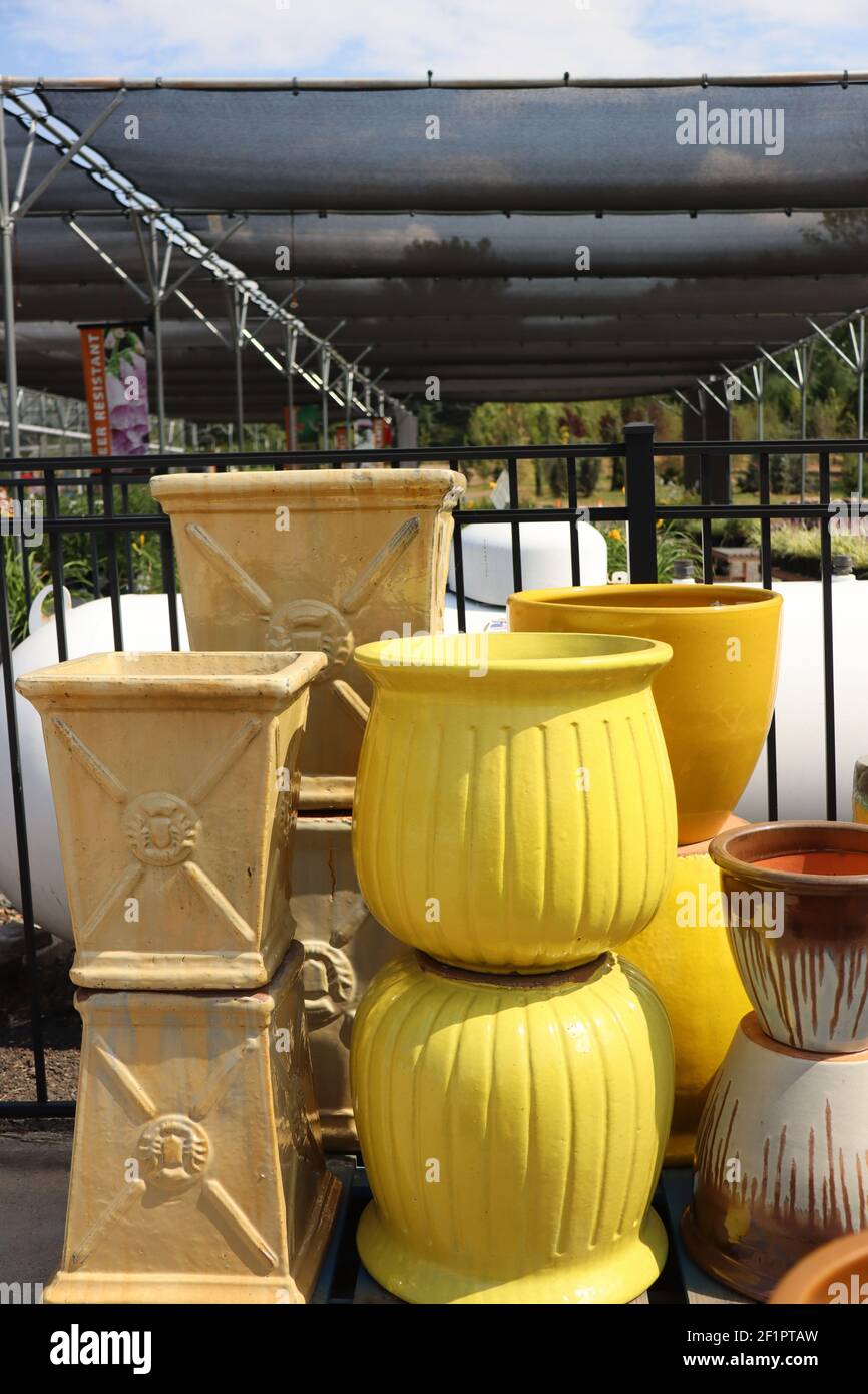 The yellow vases are on sale at the garden center Stock Photo Alamy