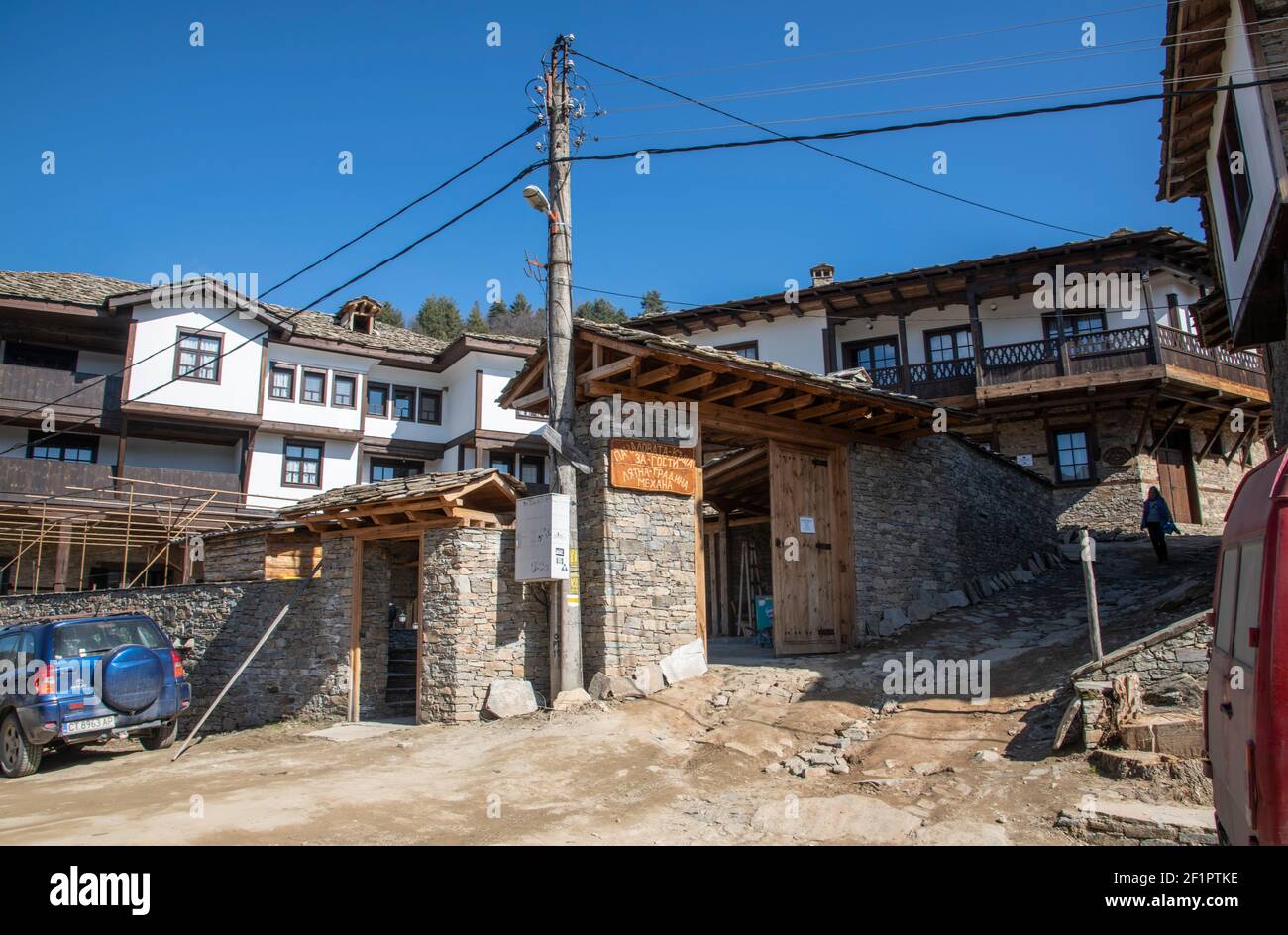 Kovachevitsa, Bulgaria - Feb 28 2021: Overviews of an authentic guesthouse in Kovachevitsa in the early spring expecting tourists Stock Photo