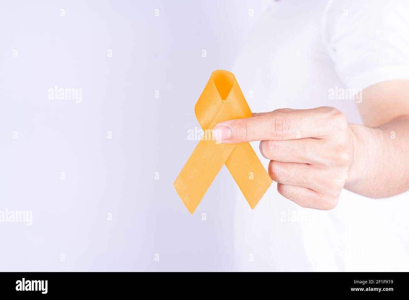 World kidney day, hands holding orange ribbon awareness of kidney