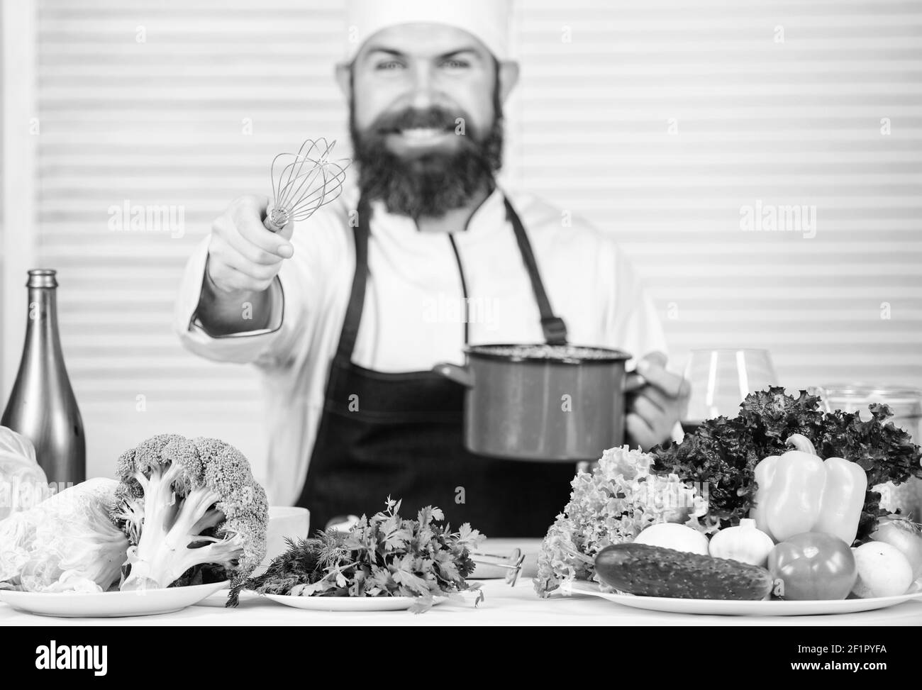 Use hand whisk. Professional chef hold whisk and pot. Whipping like pro