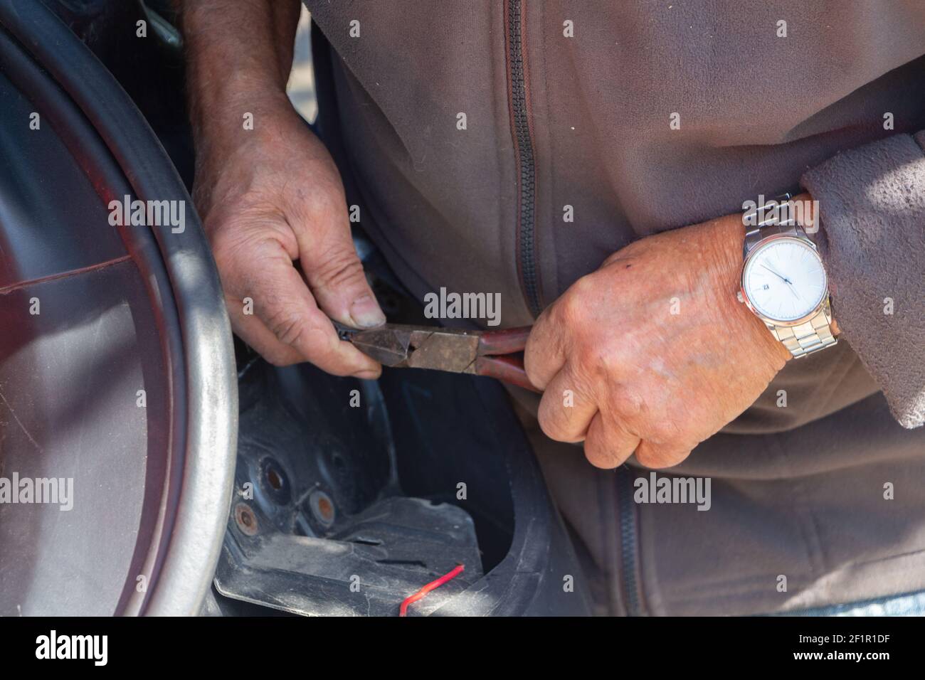 Mechanic repairing a car backlight in a garage Stock Photo Alamy