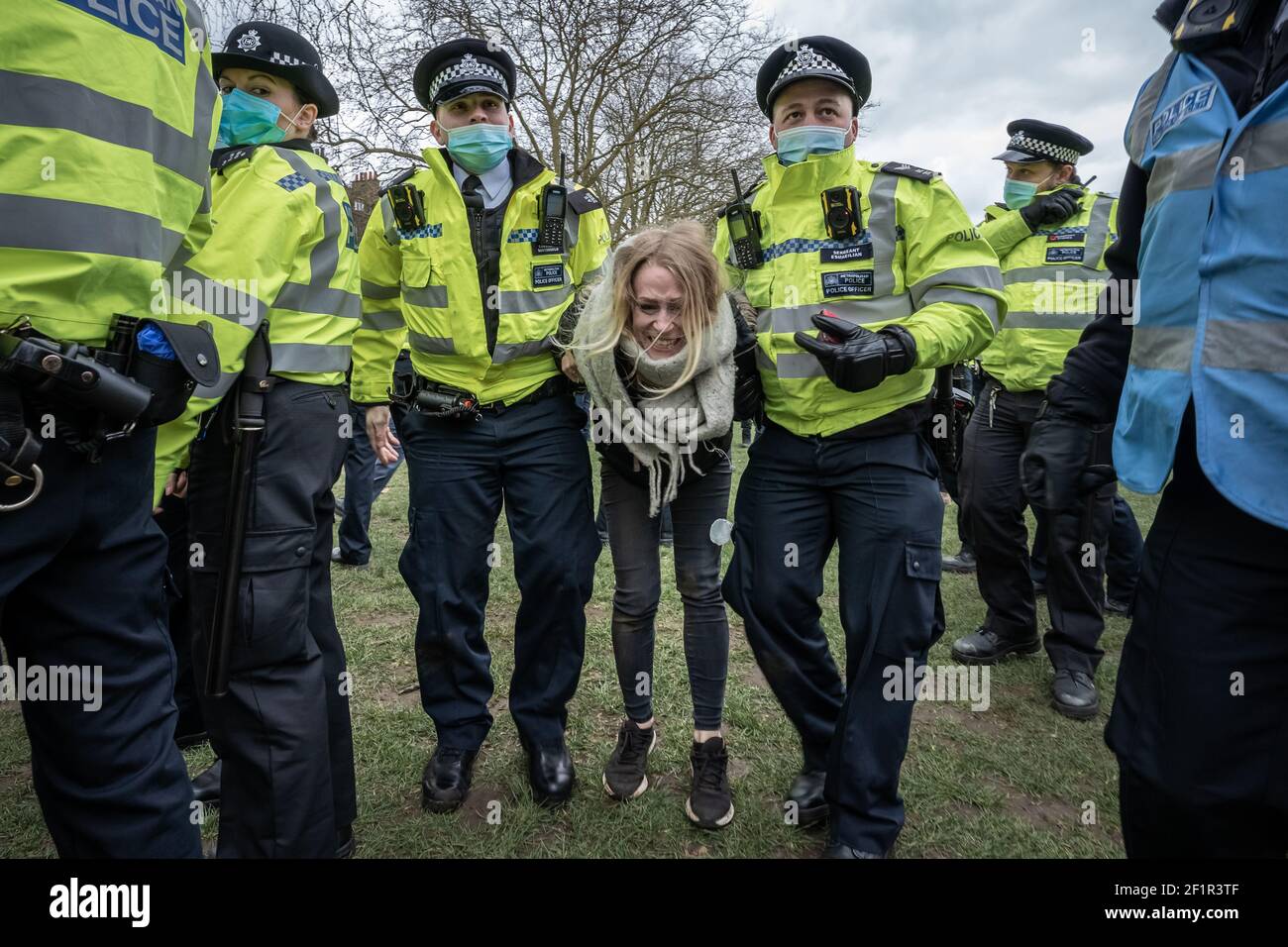 Coronavirus: Police break up and make arrests during an attempted anti-lockdown event of 20-30 protesters on Richmond Green in south east London, UK. Stock Photo