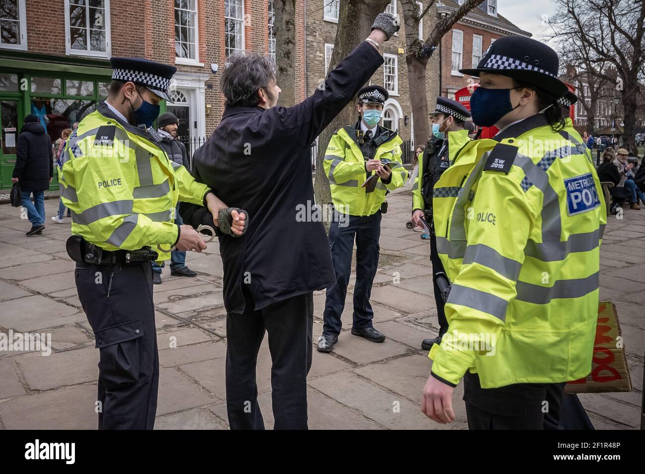 Coronavirus: Police break up and make arrests during an attempted anti-lockdown event of 20-30 protesters on Richmond Green in south east London, UK. Stock Photo