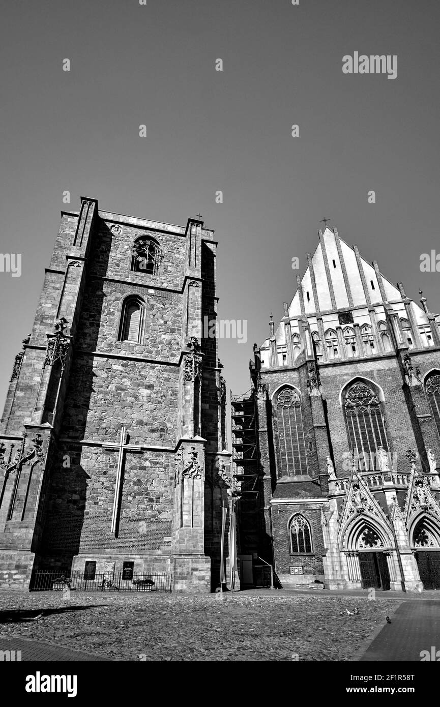 facade of a medieval Roman Catholic church in the Gothic style in Nysa, monochrome Stock Photo