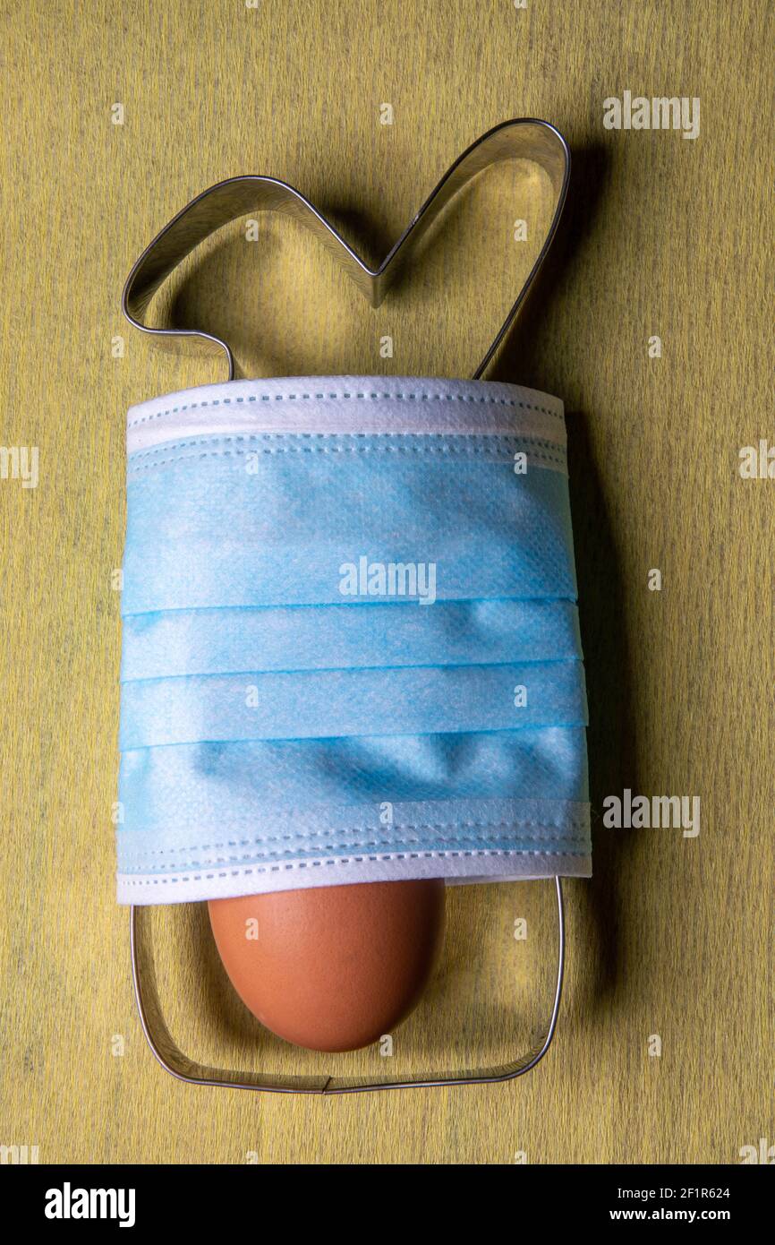Easter bunny baking pan for cookie cutter with mask and egg Stock Photo