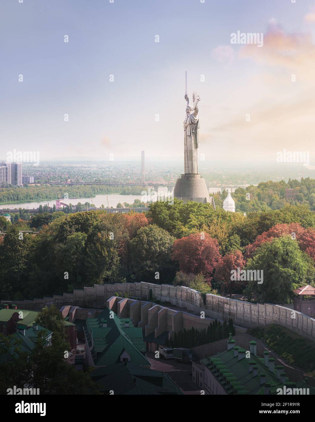 Aerial view of Kyiv city and Dnieper River with the Motherland Monument at sunset - Kiev, Ukraine Stock Photo