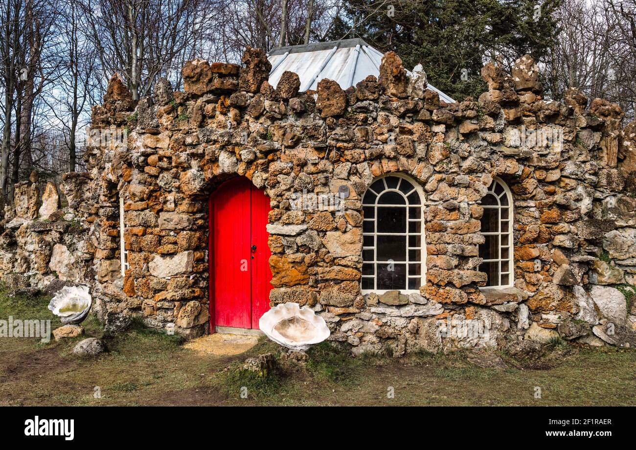 Quirky rubblestone curling lodge with arched windows and red door, Gosford Estate, East Lothian, Scotland, UK Stock Photo