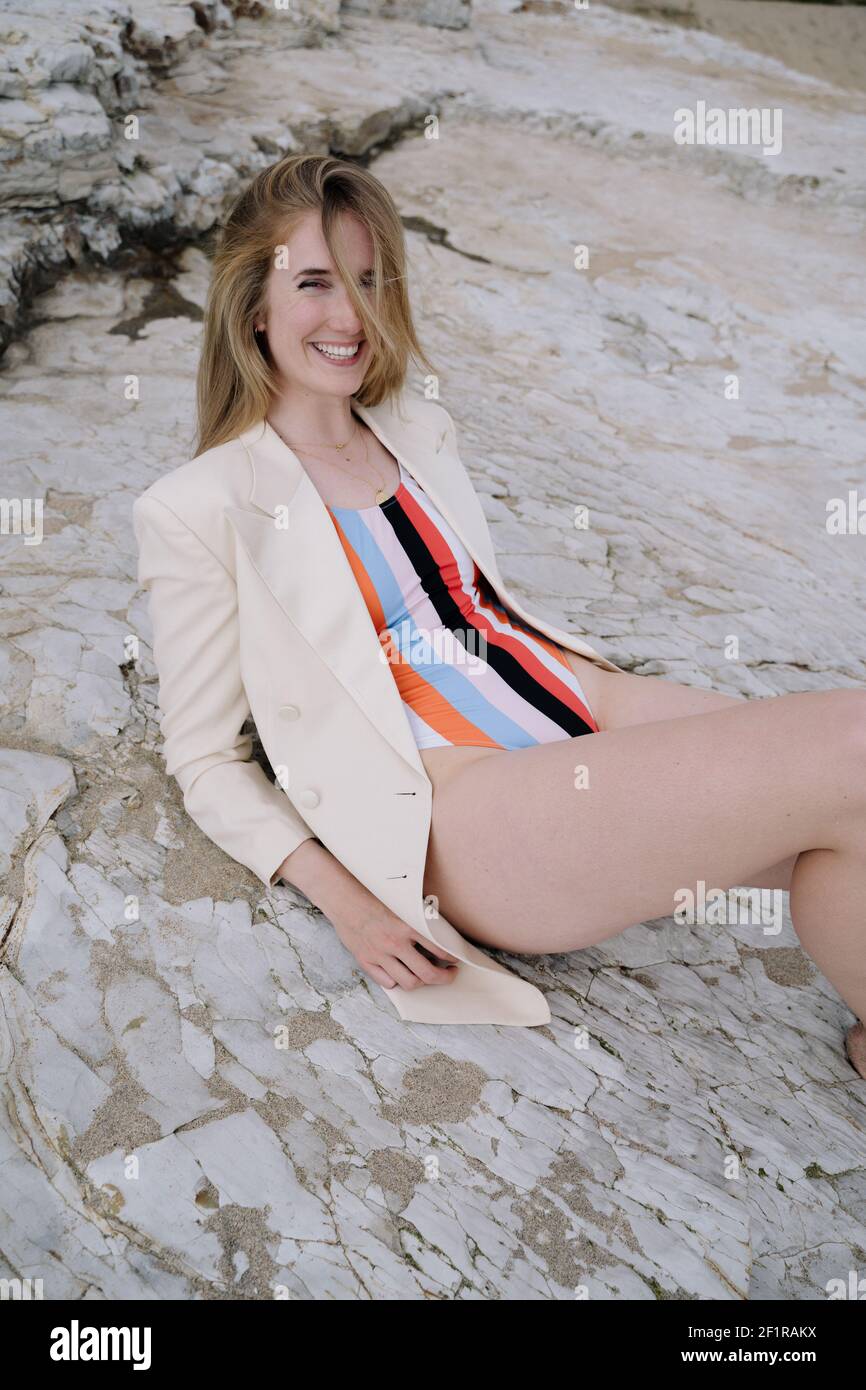 Get away girl in the jacket and swimsuit Stock Photo Alamy