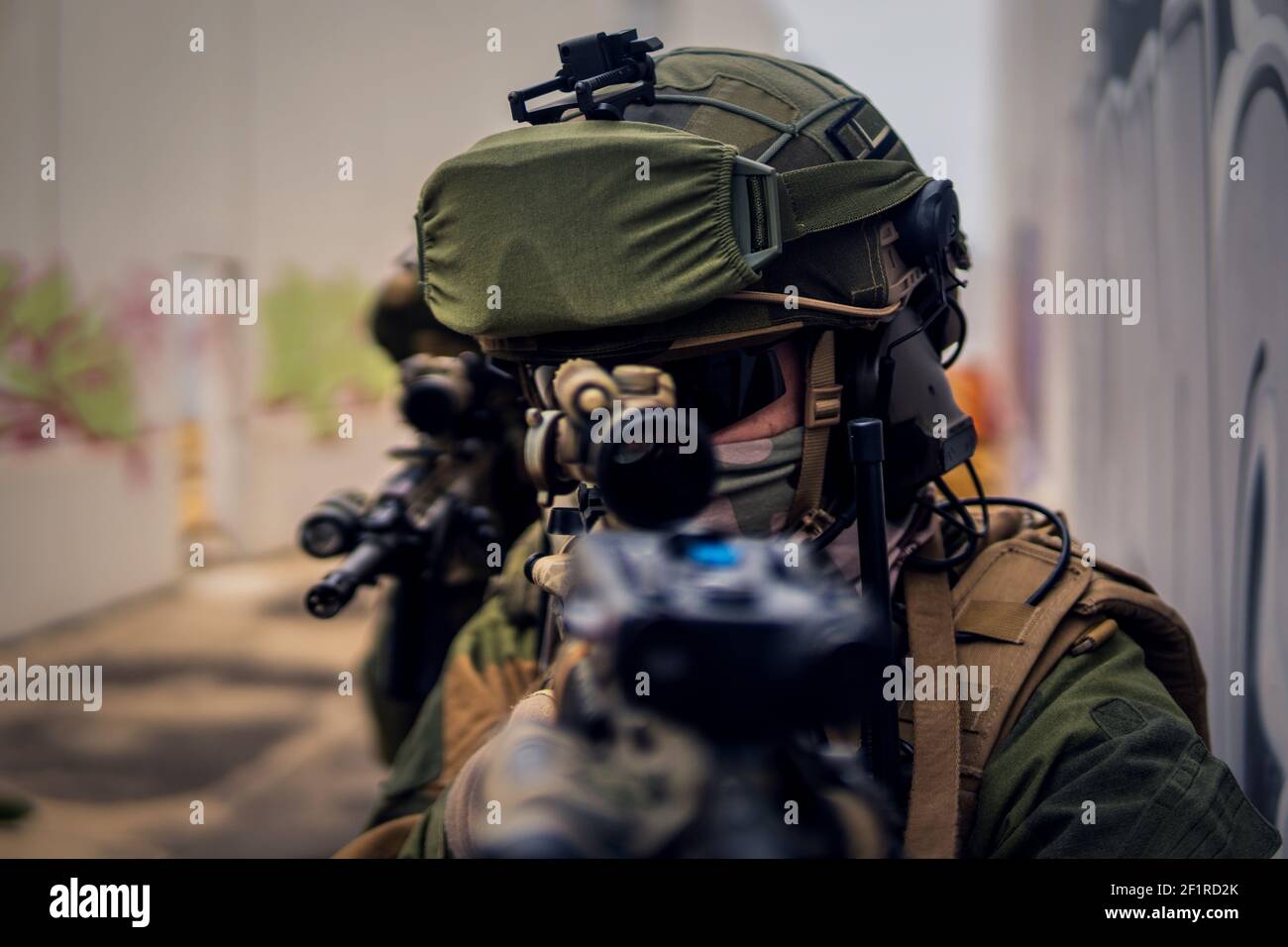 A special forces soldier aiming with an assault rifle Stock Photo - Alamy