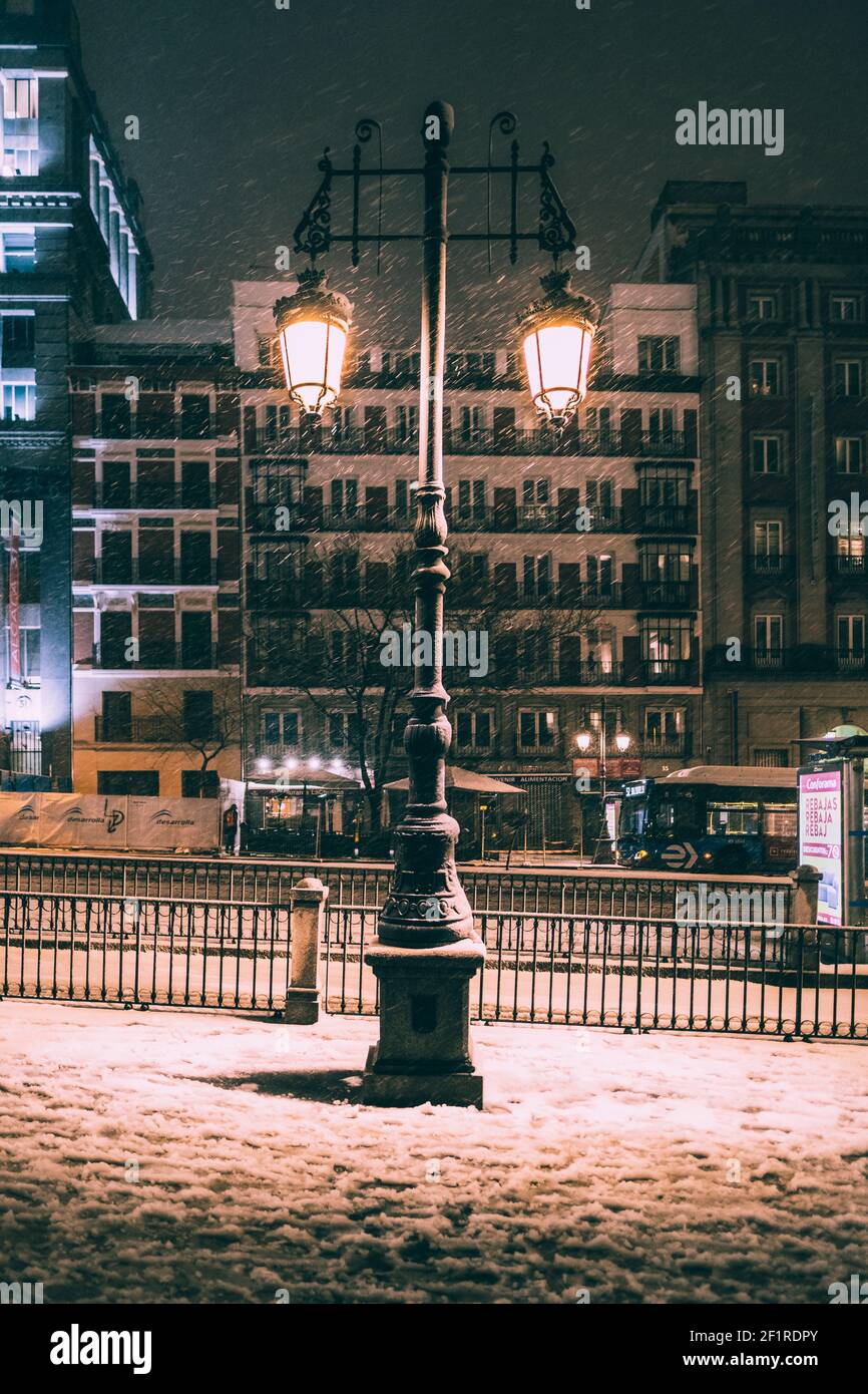 Madrid street city lights against heaviest snowfall in decades, Spain Stock Photo
