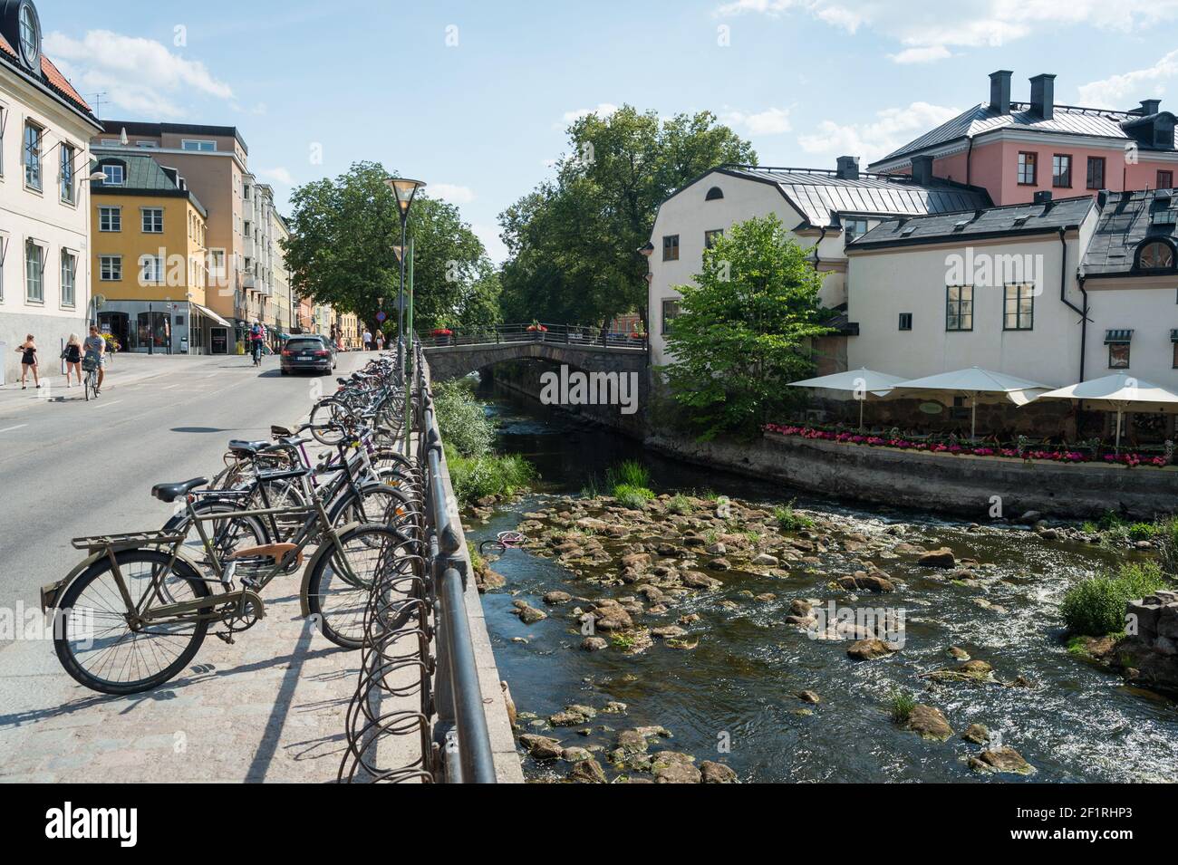 Bikes on Östra Ågatan and Fyrisån (the Fyris river), Uppsala, Sweden. Stock Photo
